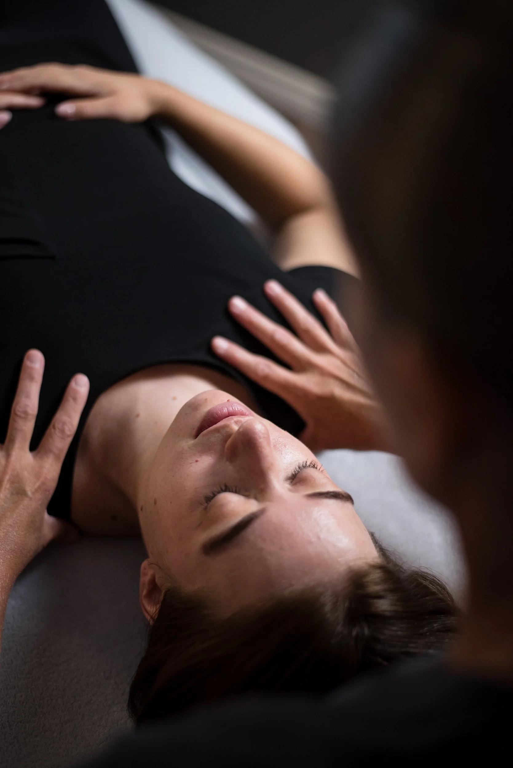 Massage therapist performing a service on her client.