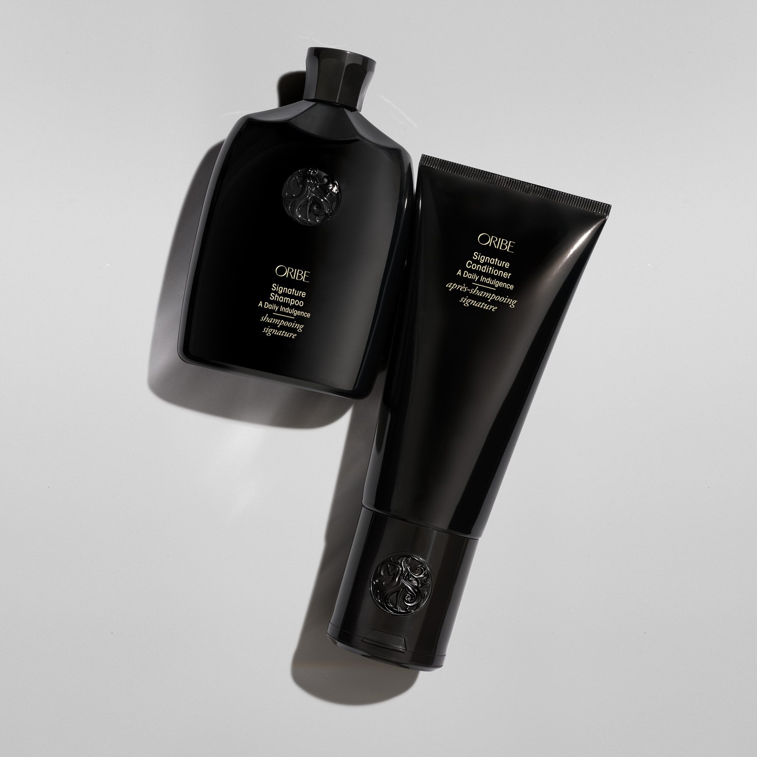 Oribe signature Shmapoo and conditioner.jpeg