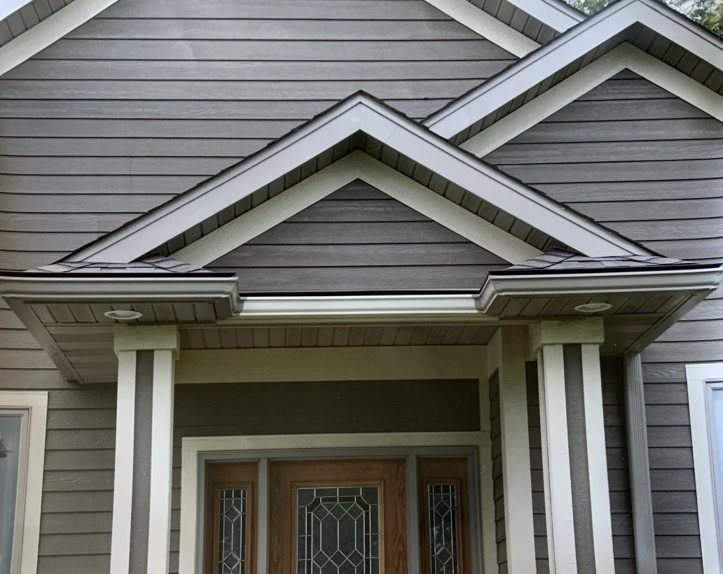 Gutter ran above an entry to move water to a better downspout location
