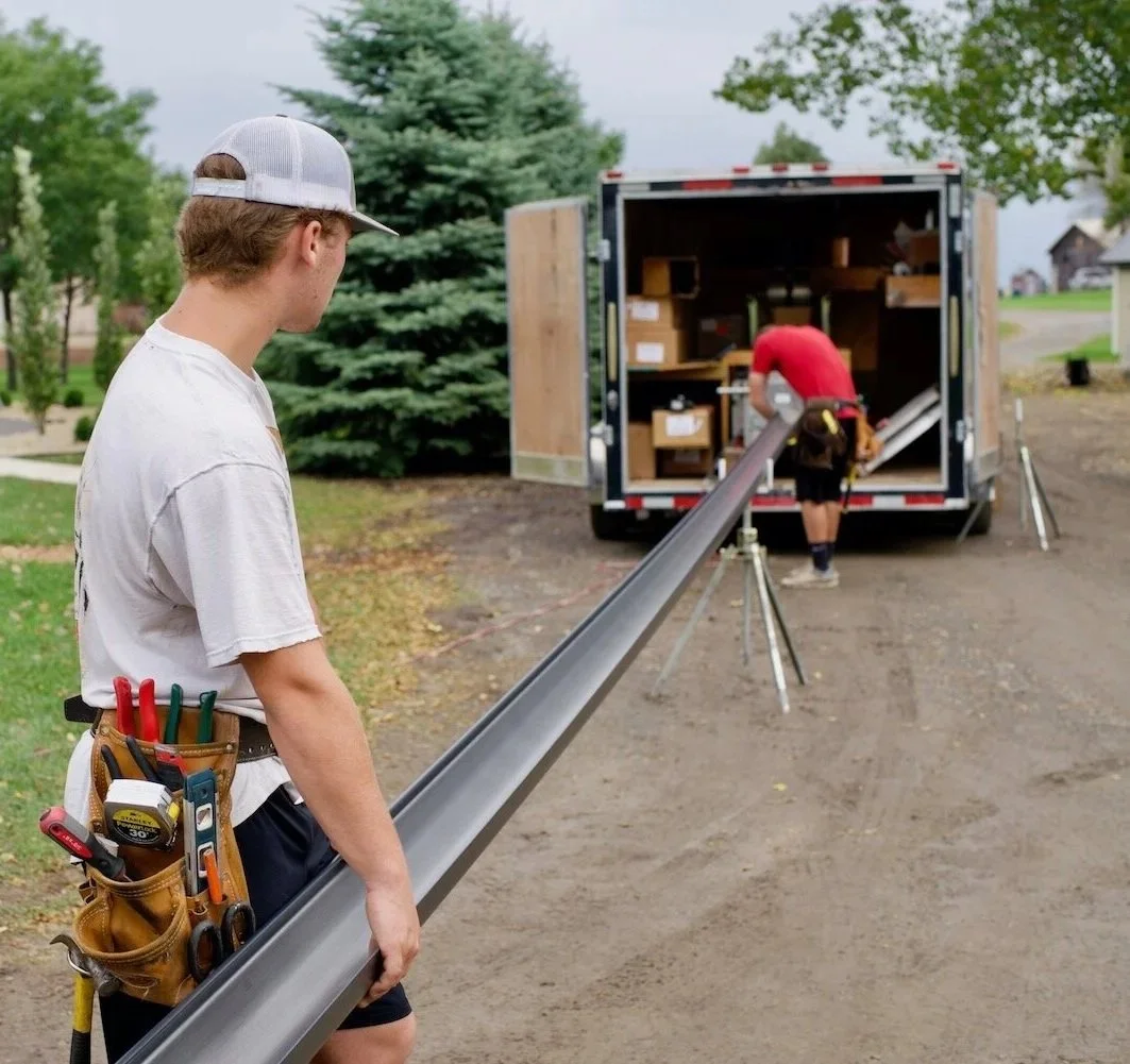 Running out a seamless half-round gutter out of the machine