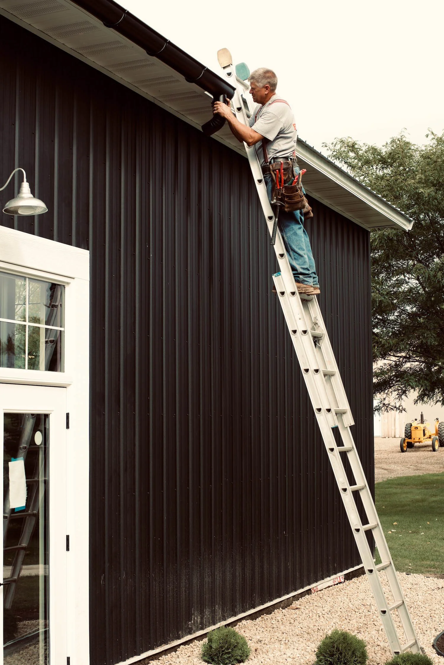 Half round downspout being installed