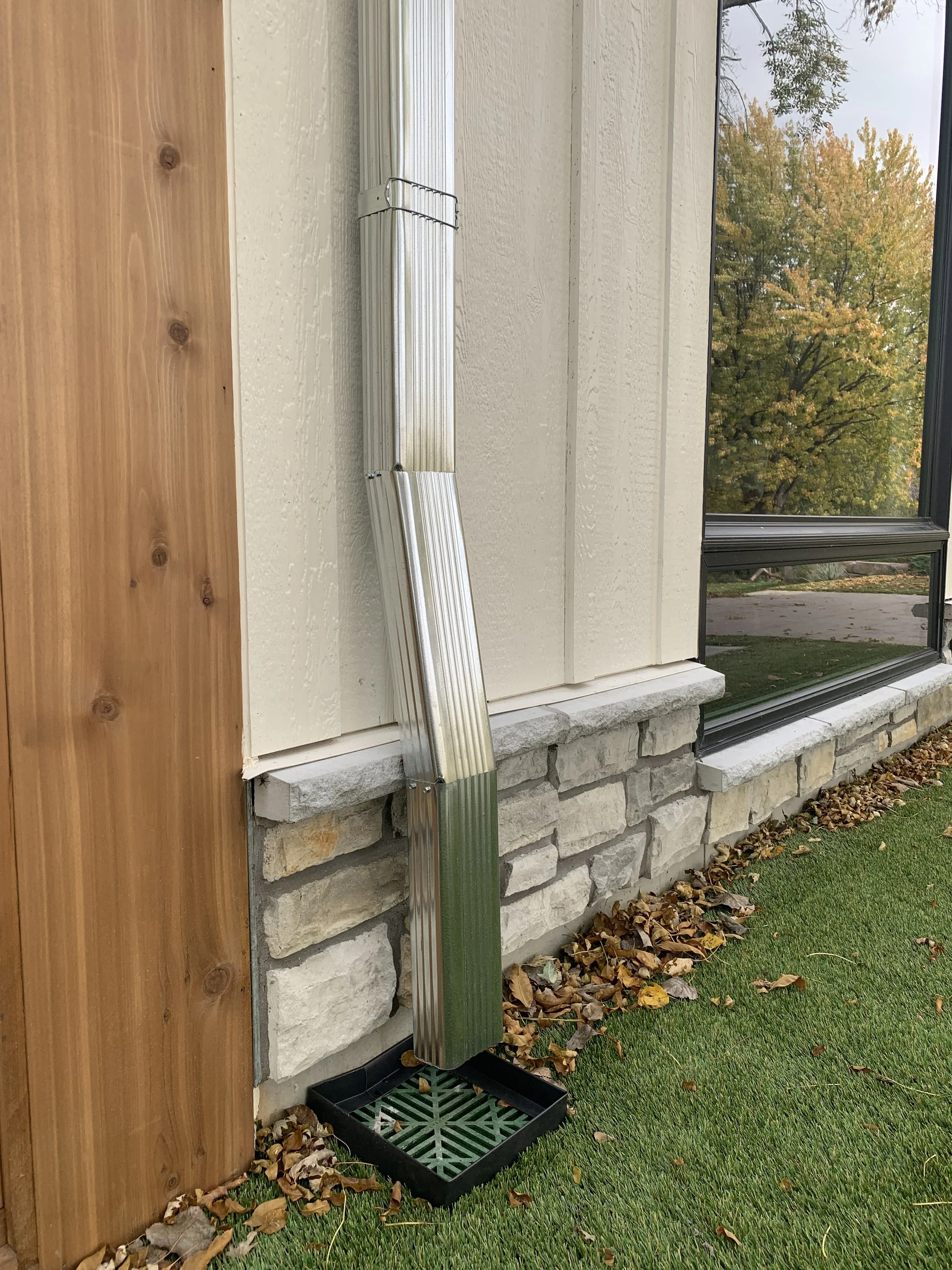 Galvanized downspout into a drain box