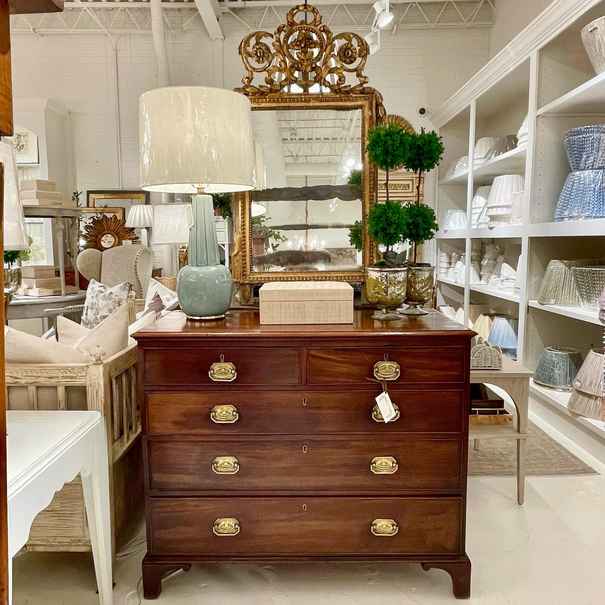 Happy Sunday. New shoppe vignette featuring an antique English mahogany 2-over-3 chest with beautiful brass hardware and an intricately hand carved antique French gilt wood mirror. Loving the mix! #heritageclt #curateddecor #europeanantiques #italian