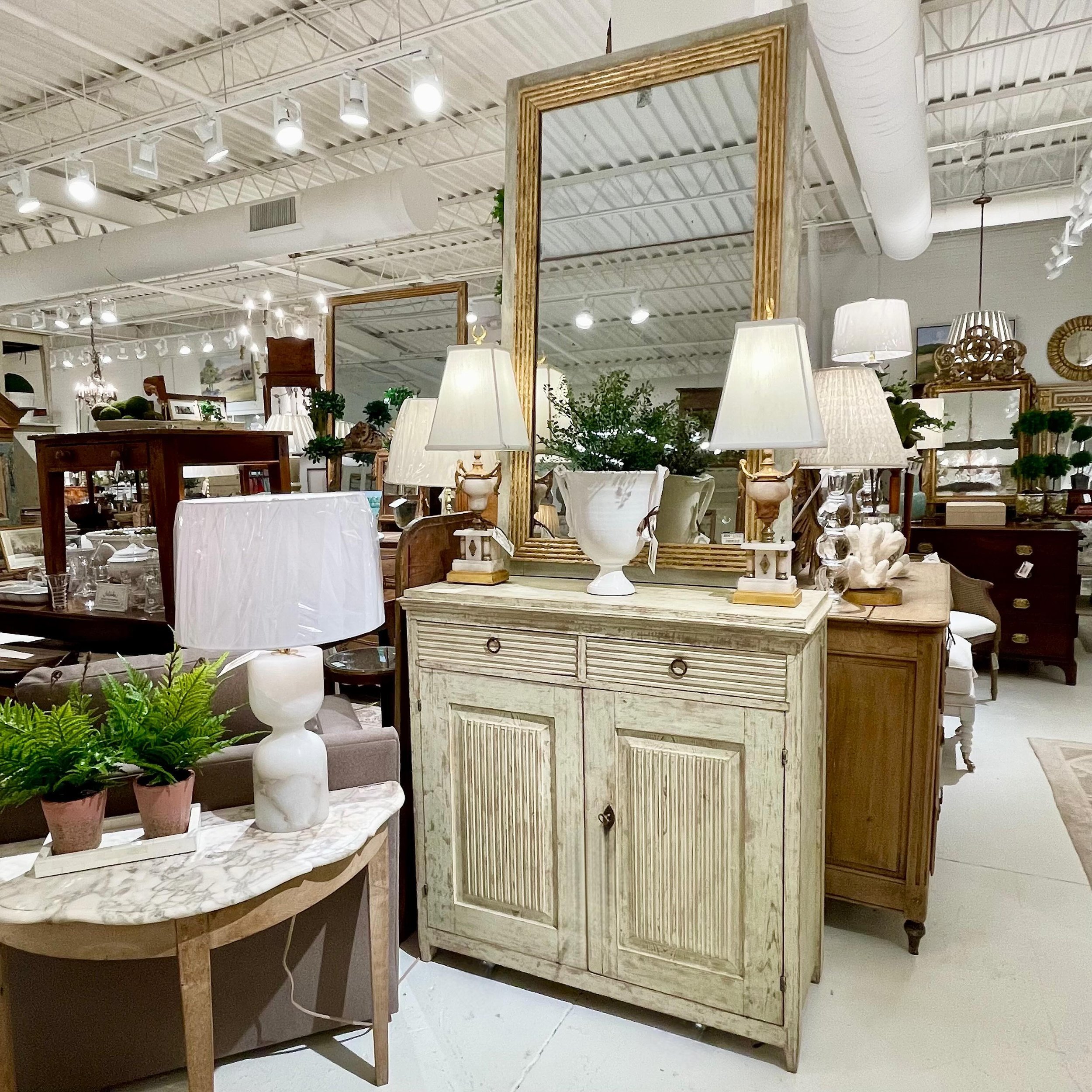 We love the Gustavian-style with reeded doors and drawers. We have several chests and buffets in the shoppe right now and beautiful reeded mirrors, too! #heritageclt #curateddecor #europeanantiques #italianantiques #englishantiques #frenchantiques #a