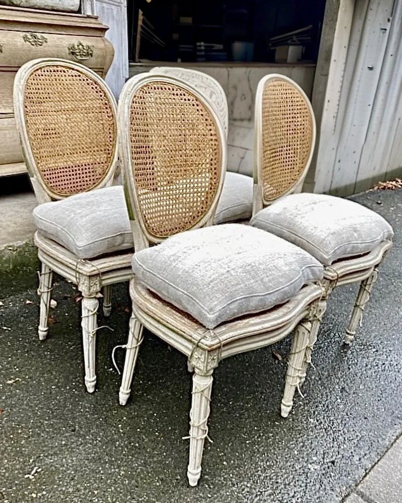 Arriving soon-Antique Louis XVI-Style Cane Back Dining Chairs. Set of 4. Perfect for a game table or breakfast table. French, c.1860. Dimensions are 18.9W x 20.4D x 37.4H | 19.6SH. Discover our extensive collection of one-of-a-kind, hand-selected Eur