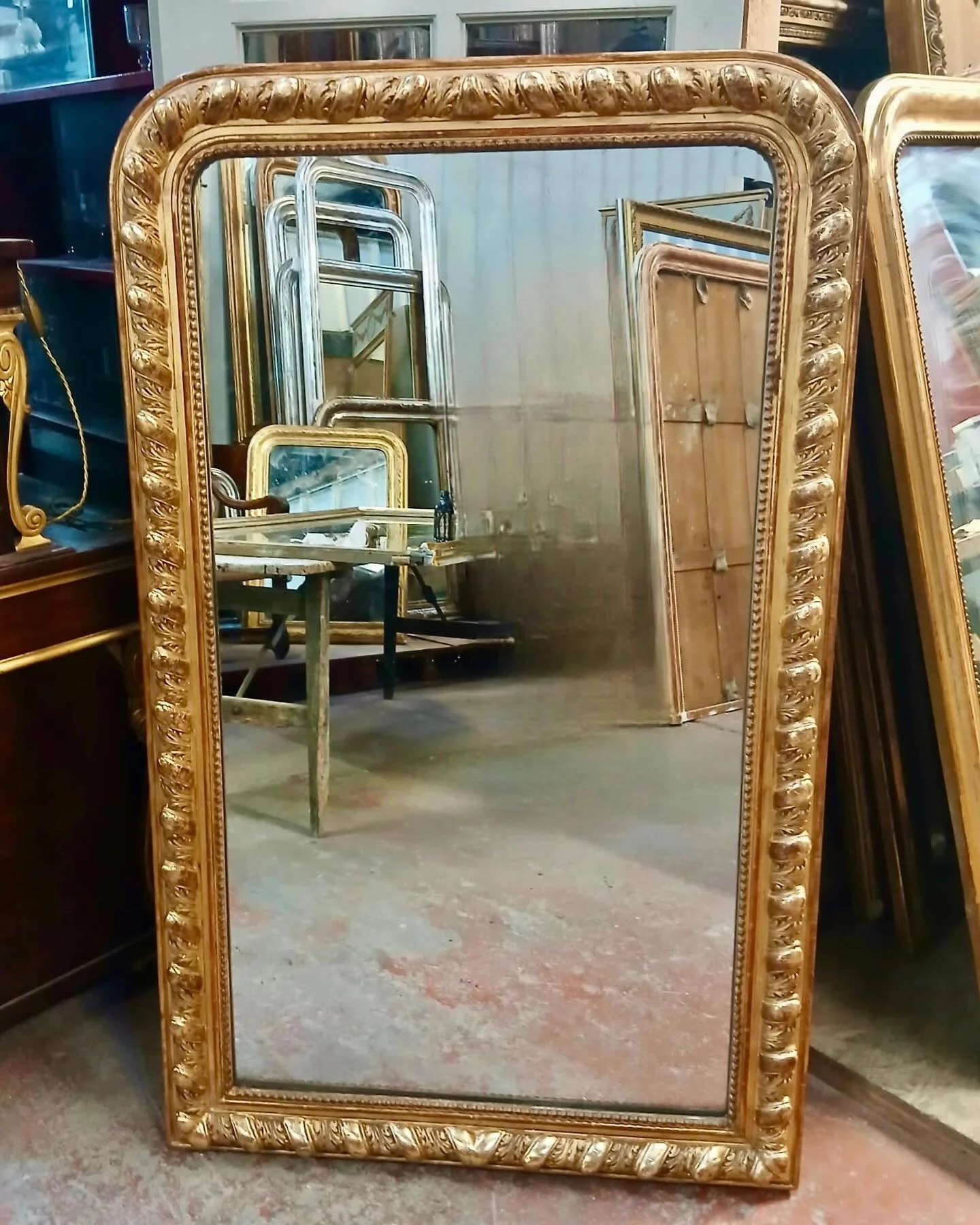 Arriving soon&mdash;a beautiful Antique Napoleon III Hand Carved Mirror with Acanthus Leaf Detail. French, c.1860. Dimensions are 33.4W x 55.1H. Discover our extensive collection of one-of-a-kind, hand-selected European Antiques and Curated Decor. Fi