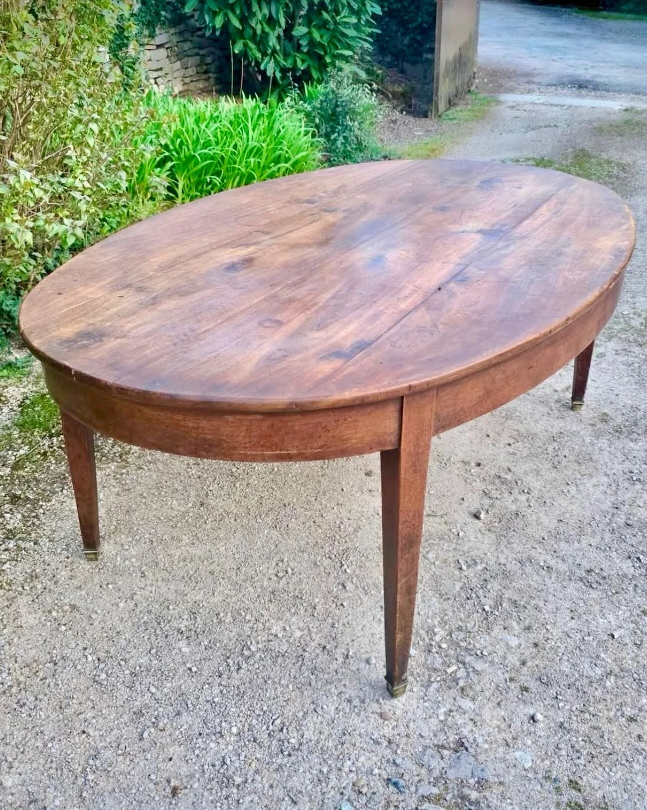 Arriving soon&mdash;a very unusual and hard to find large antique oval dining table. Antique Walnut Oval Dining Table. French, c.1850. Dimensions are 78.7W x 48.4D x 29.1H. Discover our extensive collection of one-of-a-kind, hand-selected European An