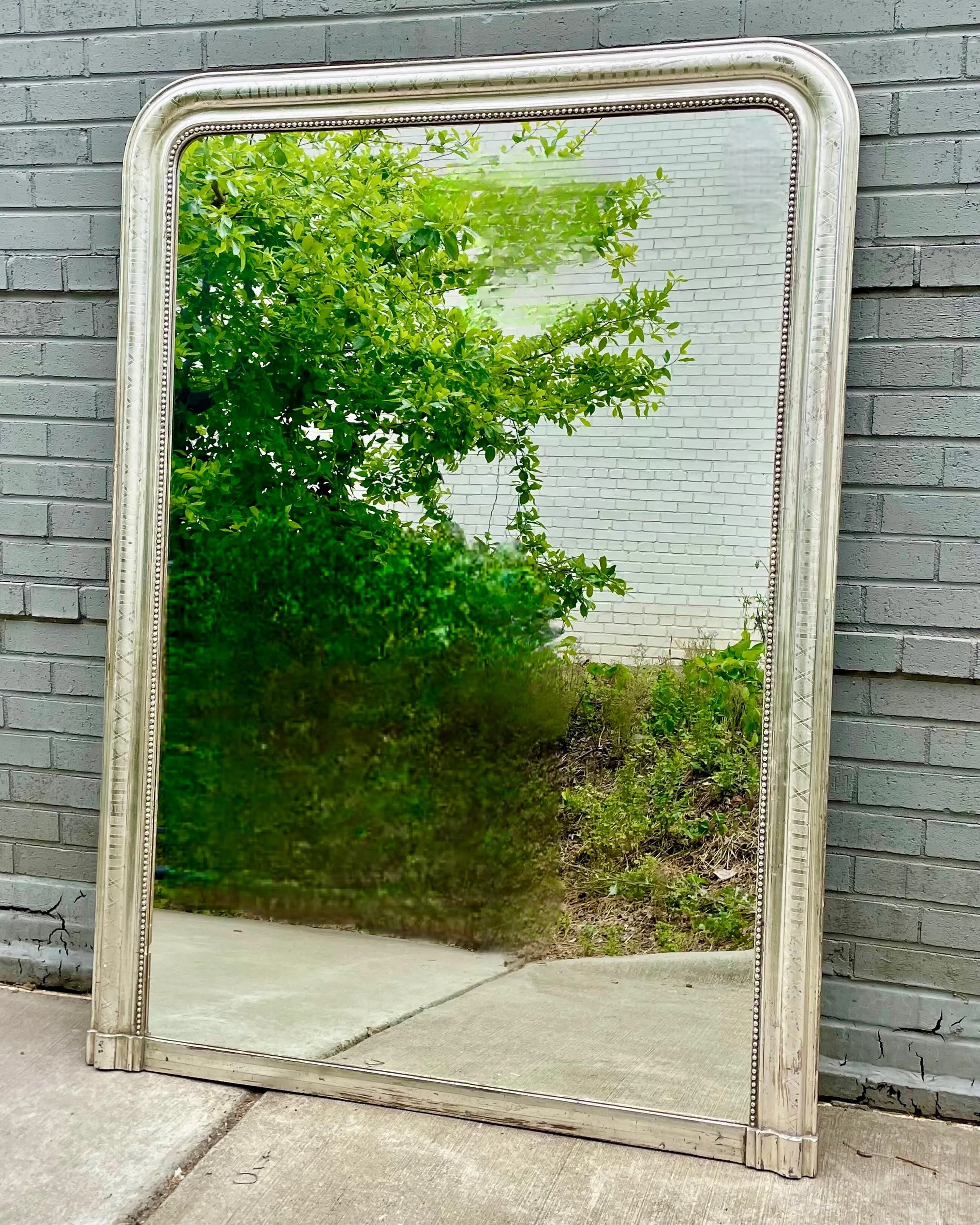 Antique Silver Gilt Louis Philippe Grand Mirror. French, c.1860. Dimensions are 45.5W x 63H. Discover our extensive collection of one-of-a-kind, hand-selected European Antiques and Curated Decor. Find more details and pics on our website at www.herit