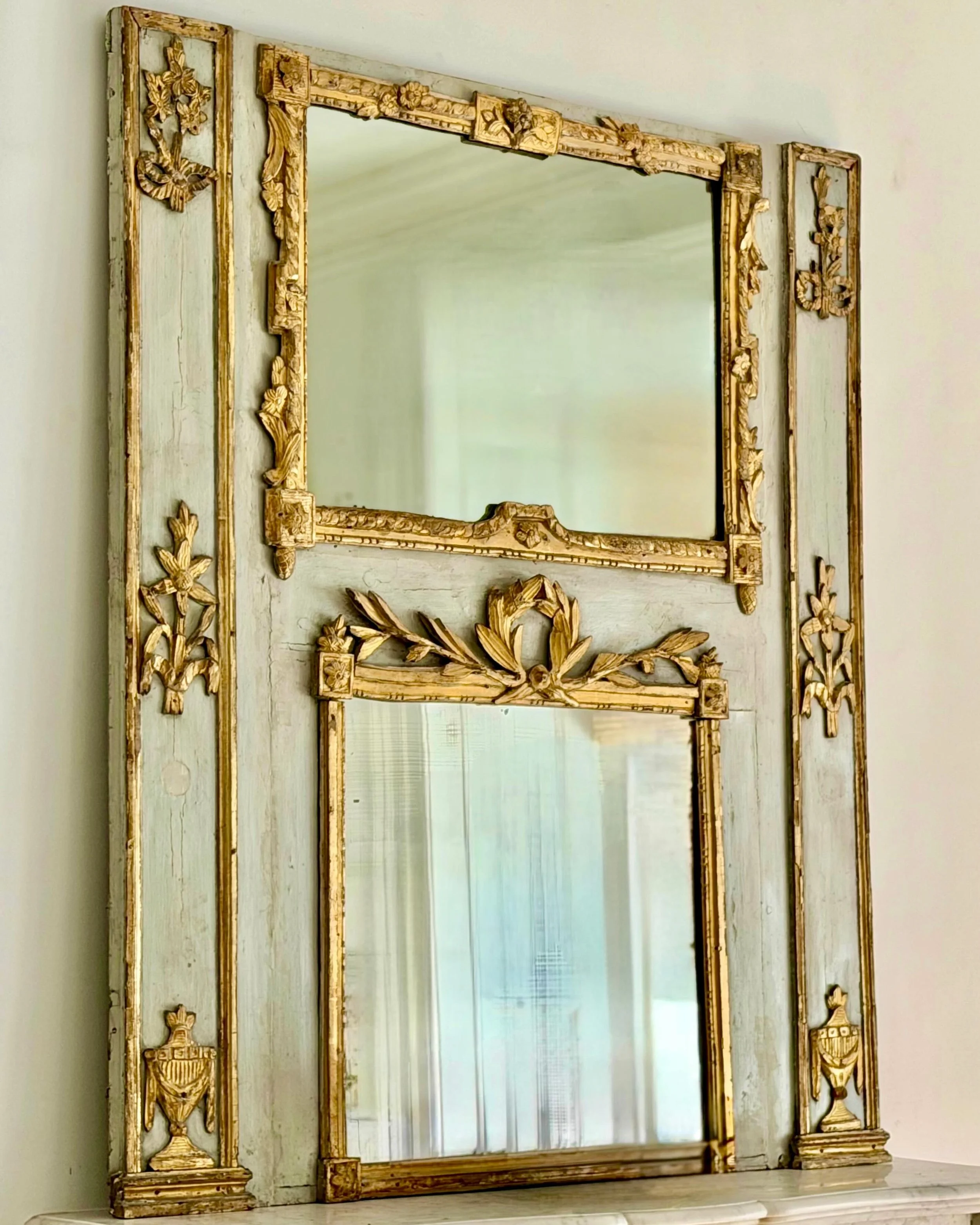 Antique Louis XVI Period Gold Gilt and Grey Boiserie Trumeau Mirror. French, c.1760. Dimensions are 45.6W x 51.9H. Discover our extensive collection of one-of-a-kind, hand-selected European Antiques and Curated Decor. Find more details and pics on ou