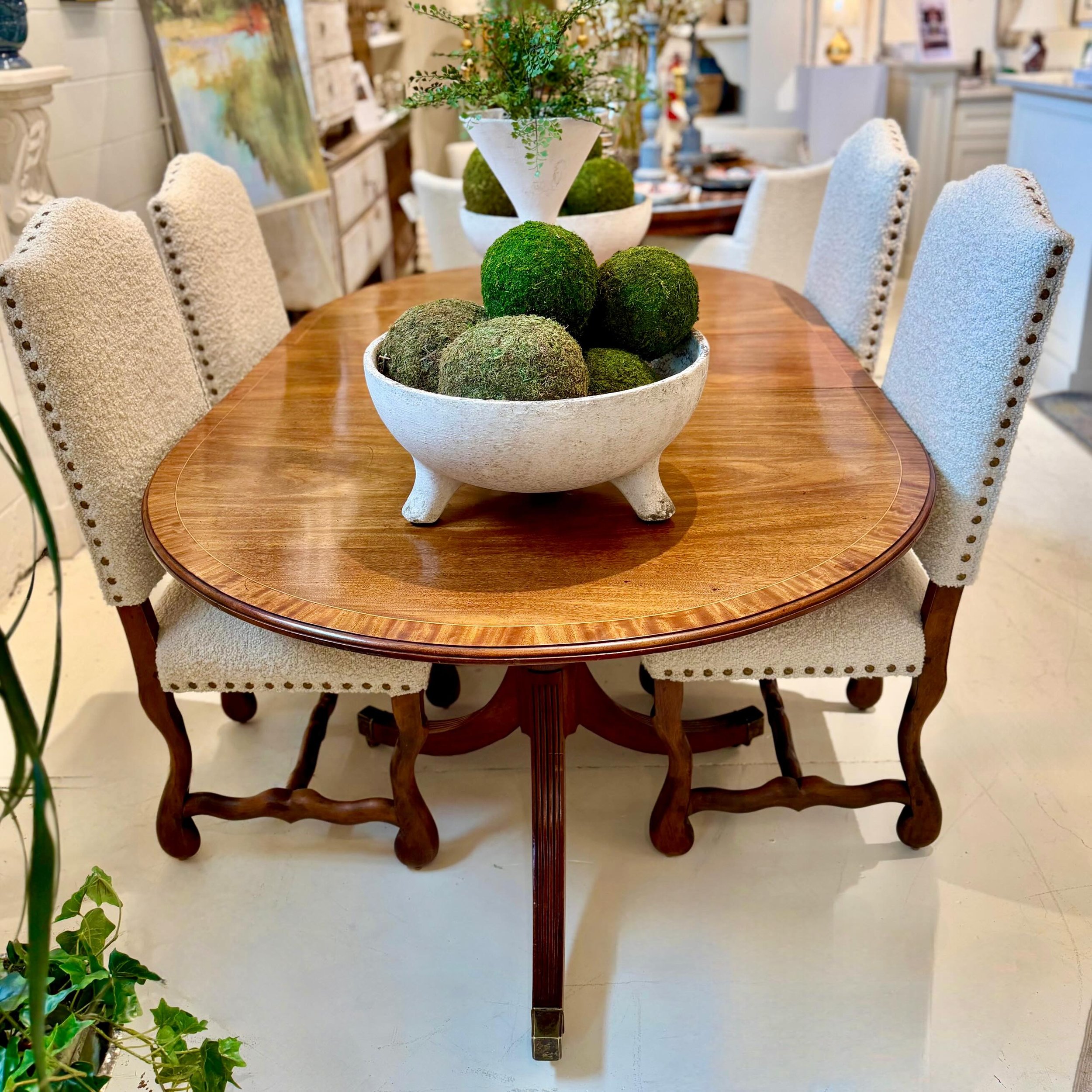 Highly sought after Antique Regency-Style Figured Mahogany Oval Dining Table with Boxwood Banding Inlay. English, c.1890. Dimensions are 64.5W (104W Max Width with 2 leaves) x 47.6D x 29H. Two leaves: 14.3W and 24.4W. Discover our extensive collectio