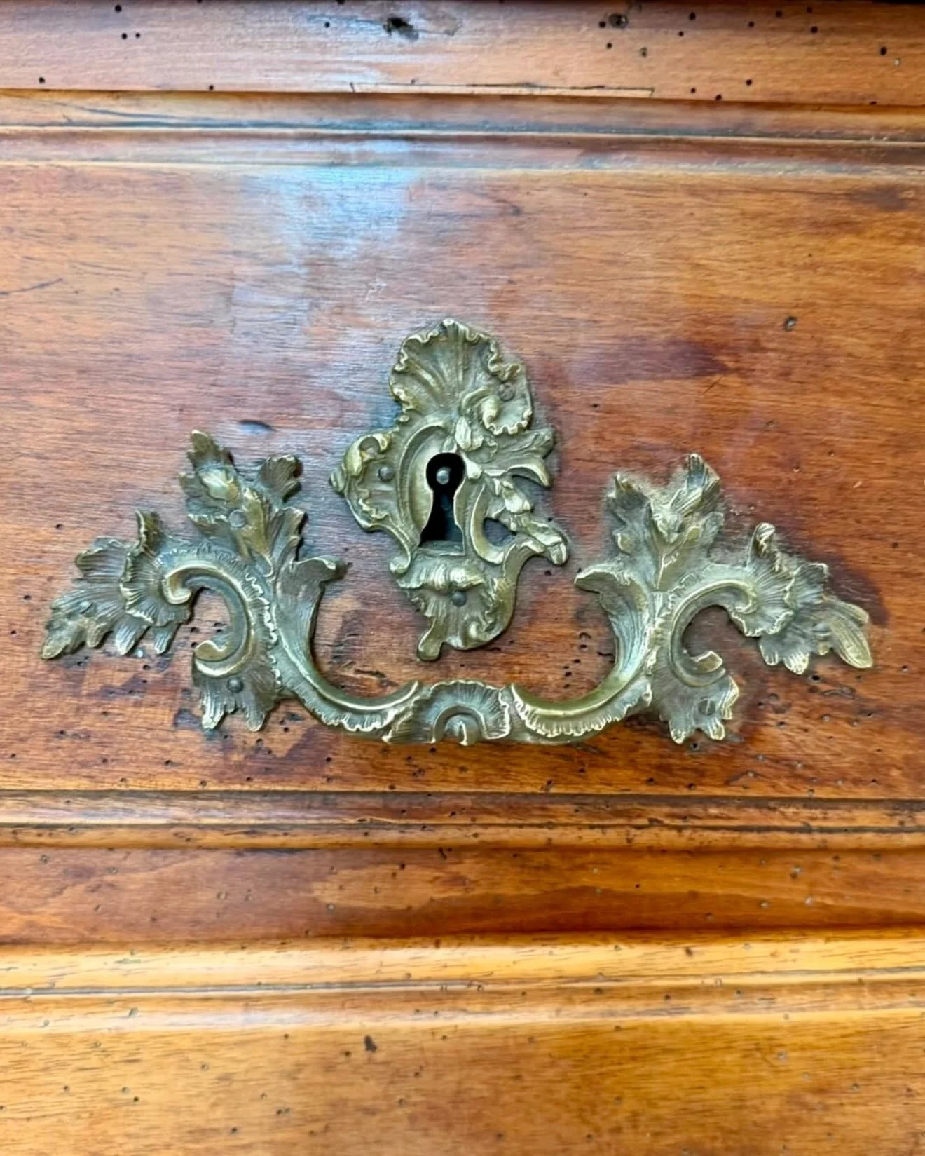 Incredible details on this Antique Louis XV Period Walnut Chest. All original bronze hardware. French, c.1725. Dimensions are 50.3W x 21.6D x 33.4H. Discover our extensive collection of one-of-a-kind, hand-selected European Antiques and Curated Decor