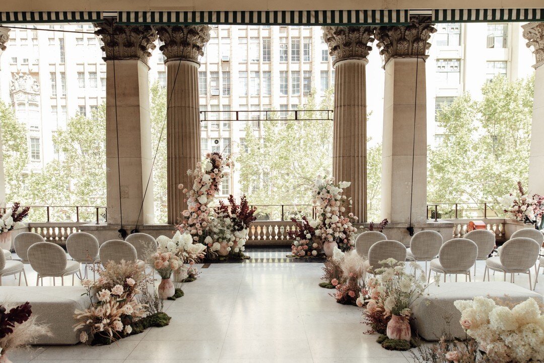 Ti and Charlie's ceremony left an unforgettable impression. Set at the Melbourne Town Hall overlooking Swanston Street, guests were captivated by the grandeur of the city, the palatial pillars and the timeless styling. Walking into such a scene immed