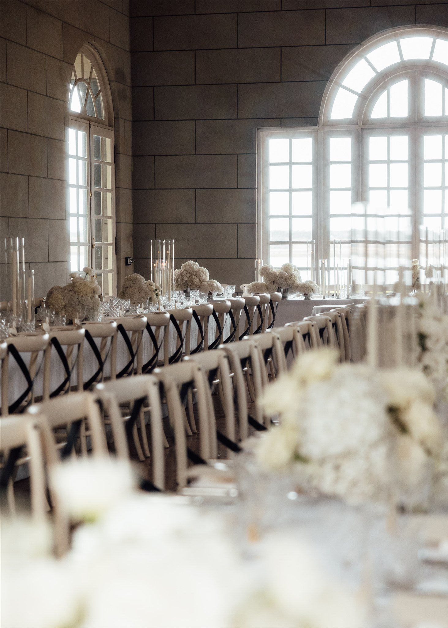 Wedding reception with white flowers and soft natural light