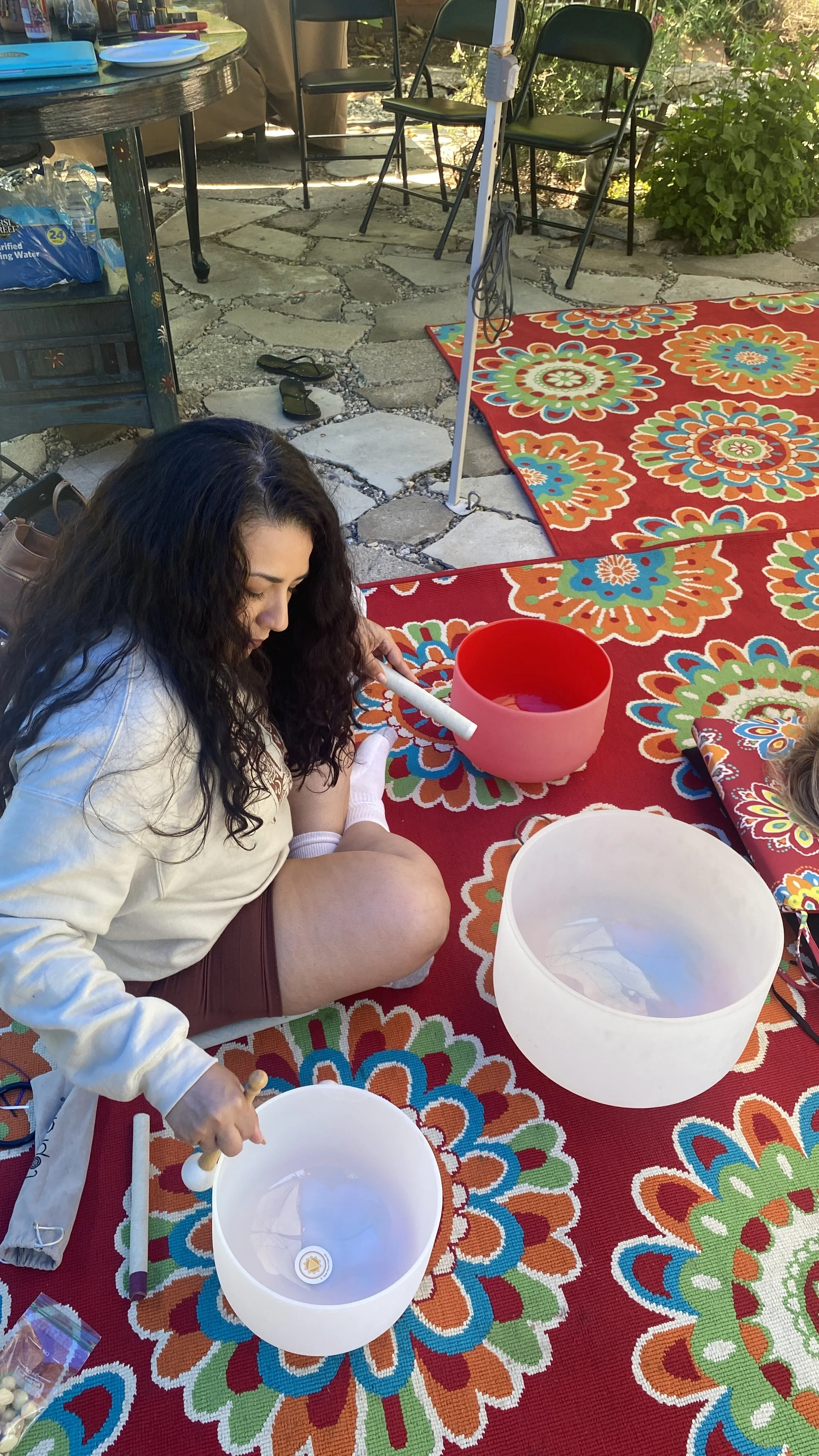 Students practicing sound healing instruments together during the certification training