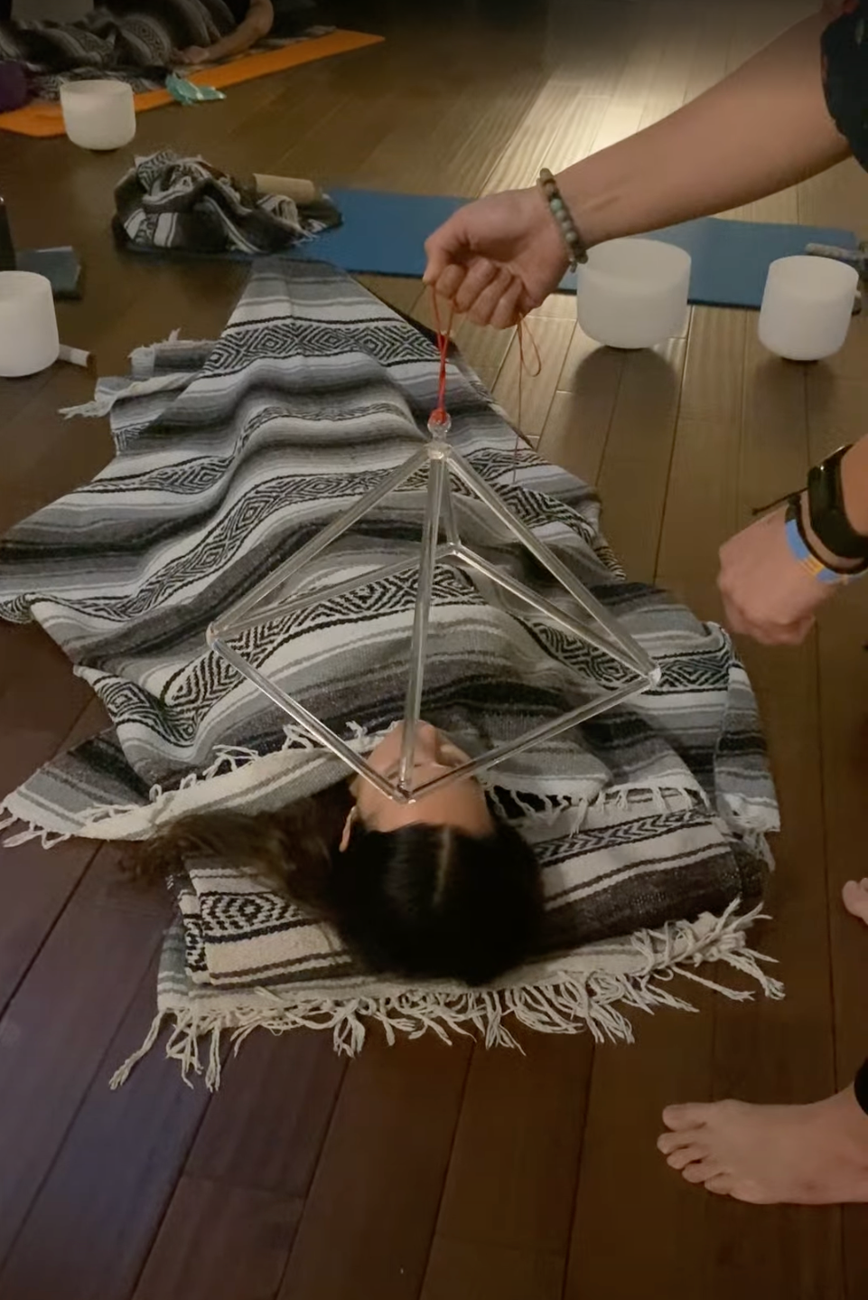 Students practicing with crystal sining pyramid during Day 1 of the Sound Healer Certification Training