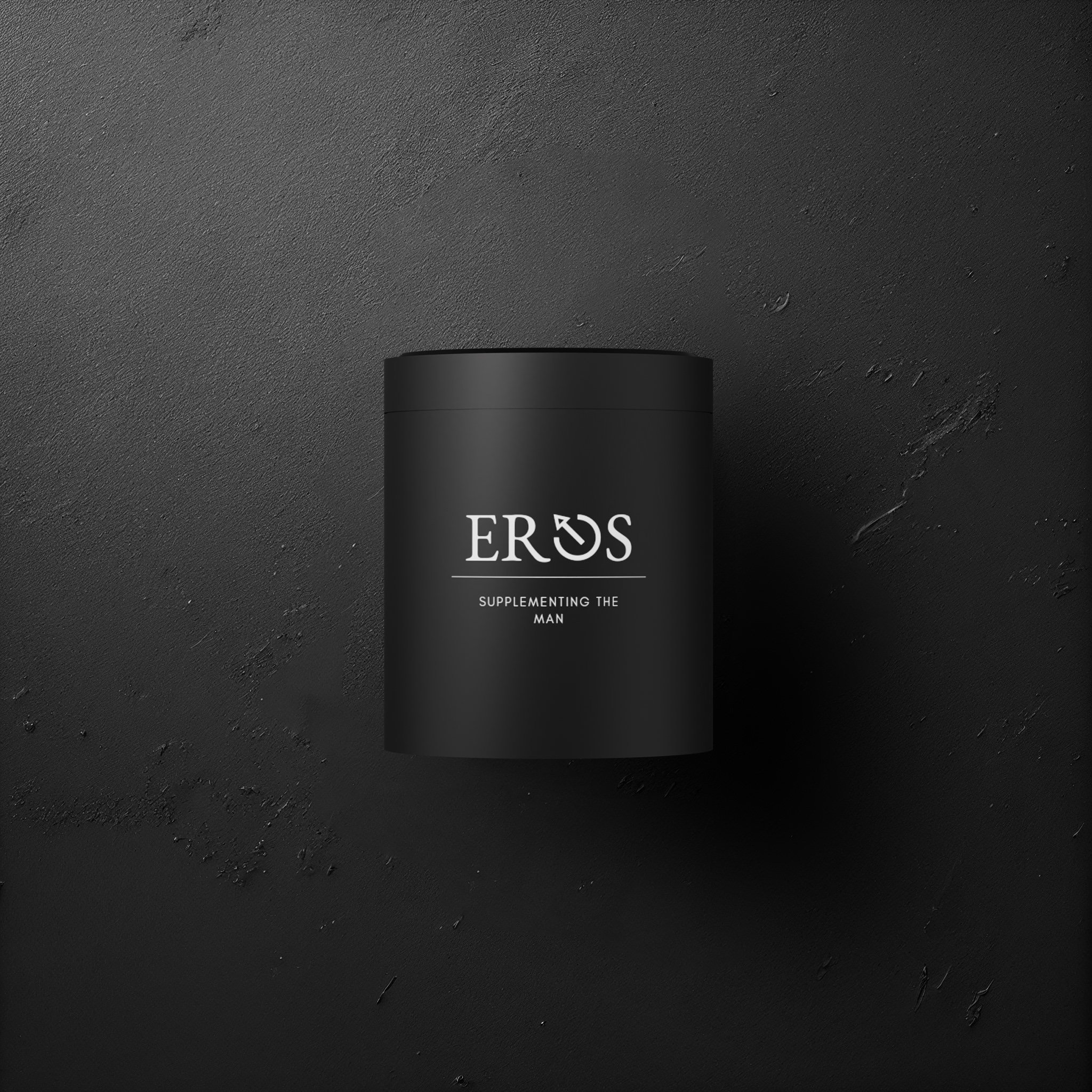 Black metal vessel embossed with logo 'EROS - SUPPLEMENTING THE MAN' placed against a black textured worktop