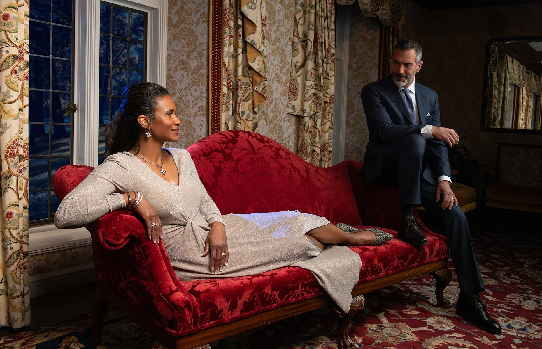 Elegant couple relaxing in a luxury hotel lounge, showcasing high-end hospitality lifestyle photography for branding and marketing use