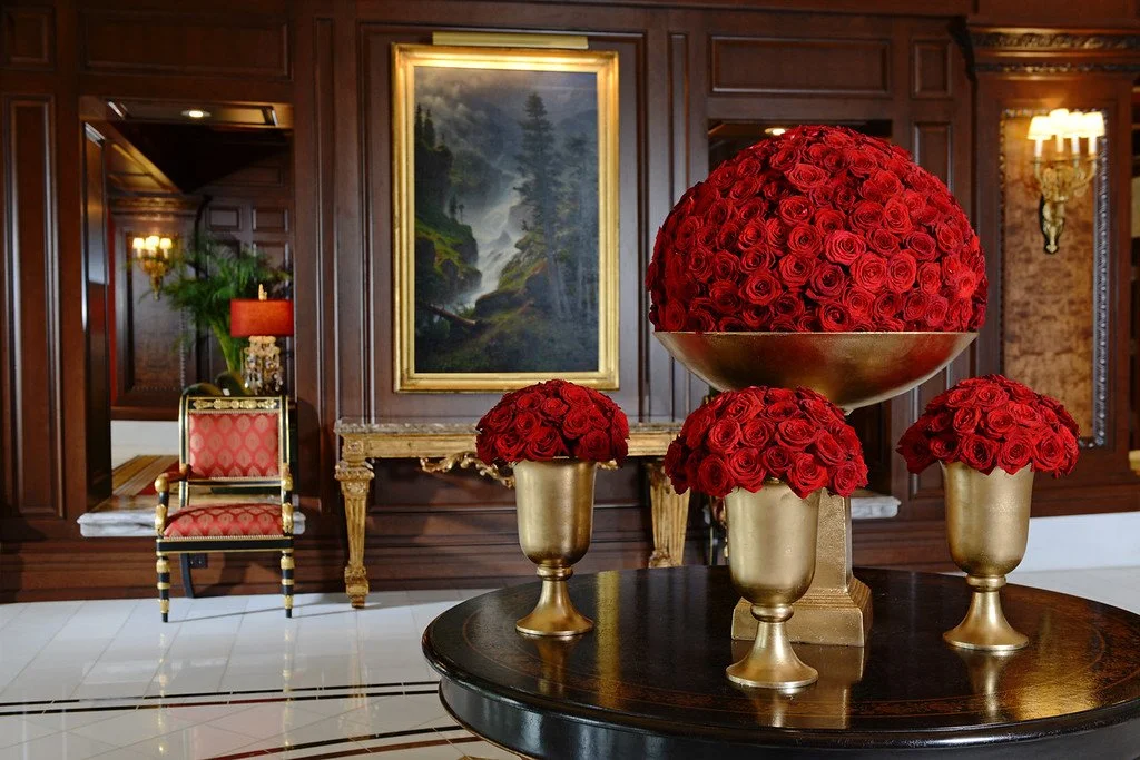 Luxury hotel lobby with floral arrangements and refined interior design, photographed for hospitality public relations and media-ready campaigns.