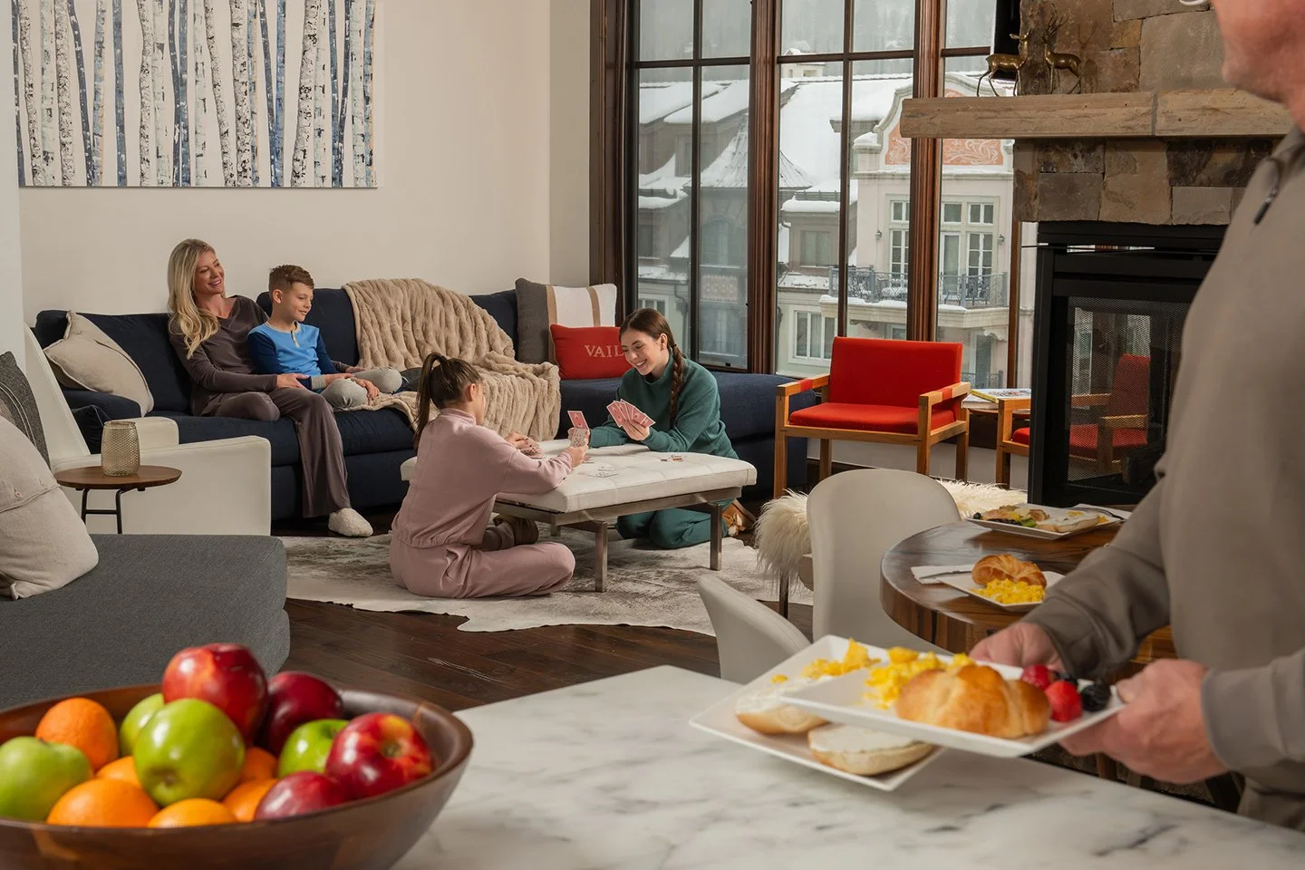 Resort lifestyle photography showing a family enjoying a spacious living area, influencing guest perception before arrival