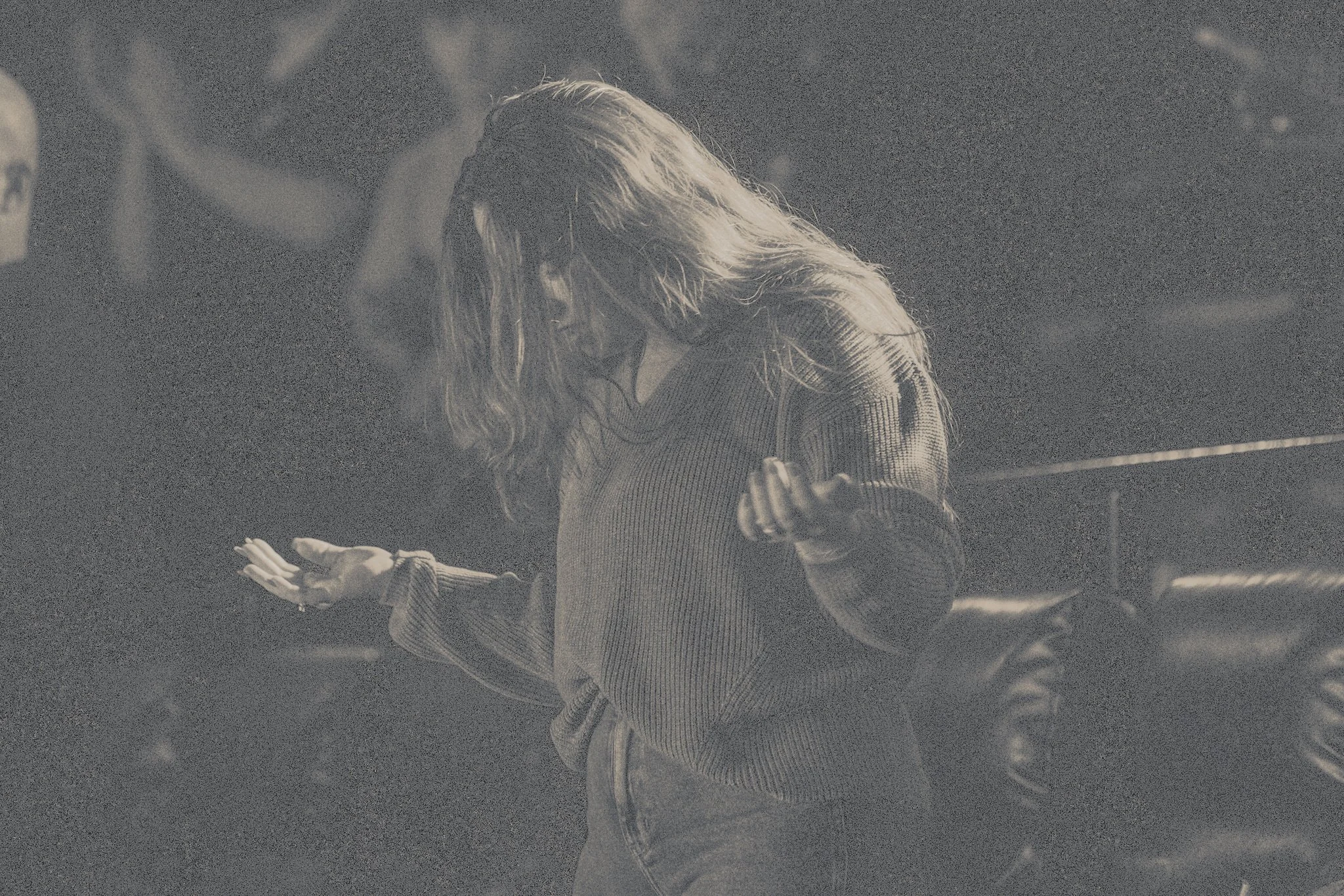 young woman worshiping God with passion