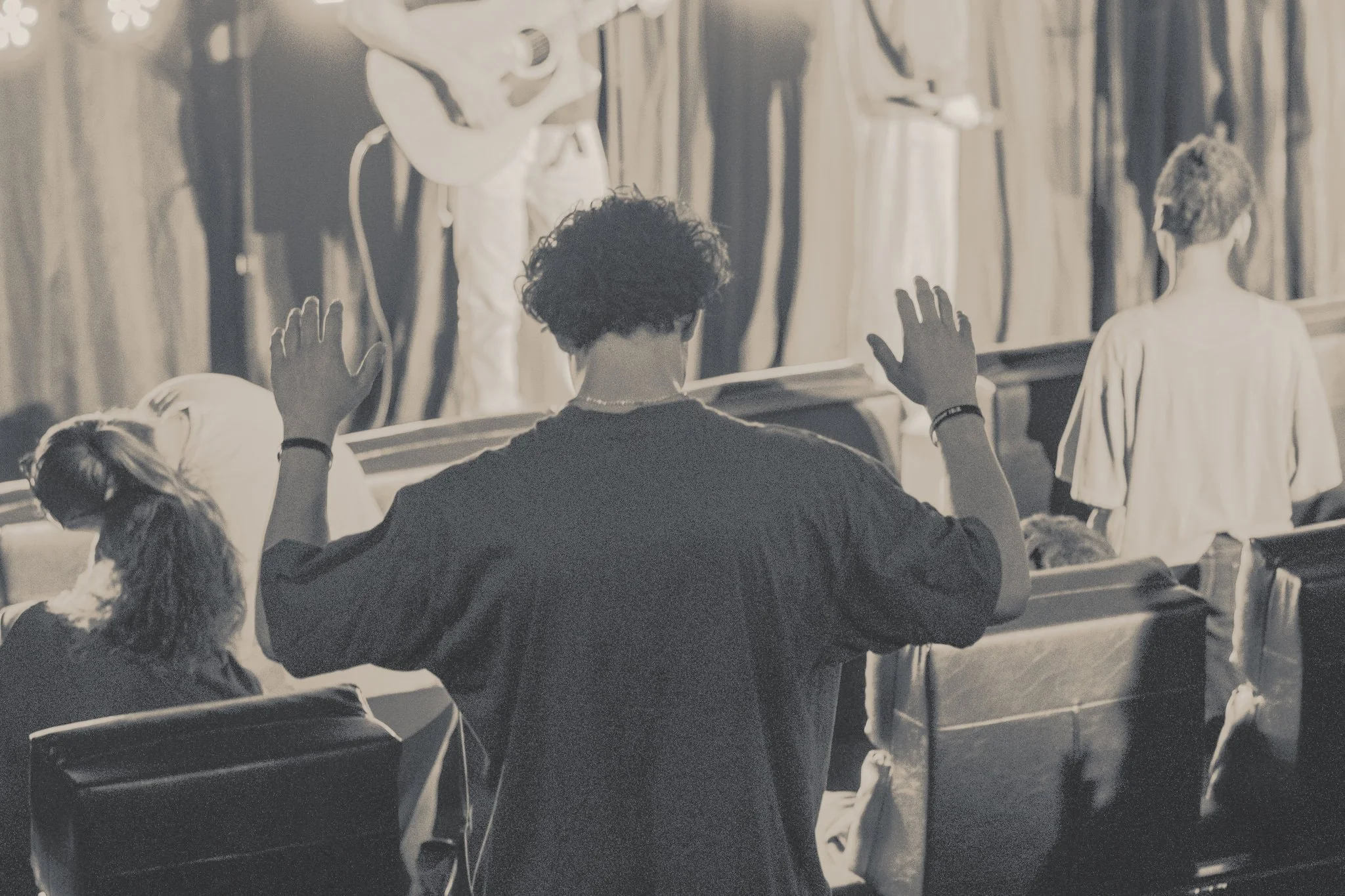 young man worshiping God with passion
