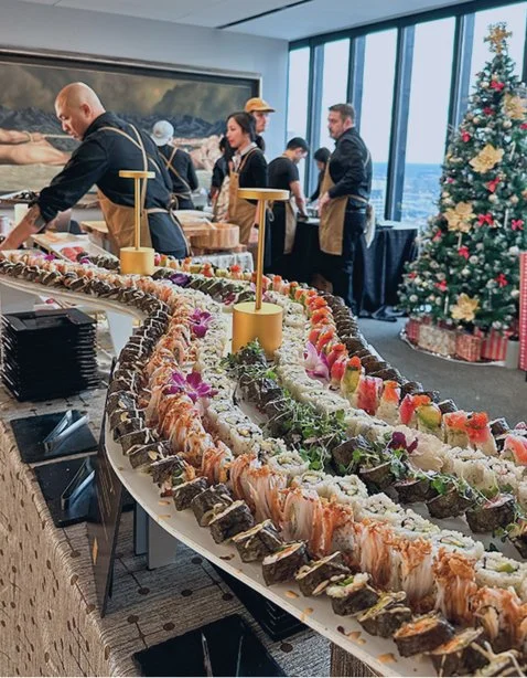 Large sushi platter for sushi catering with lavsushi with various sushi rolls on a buffet table,