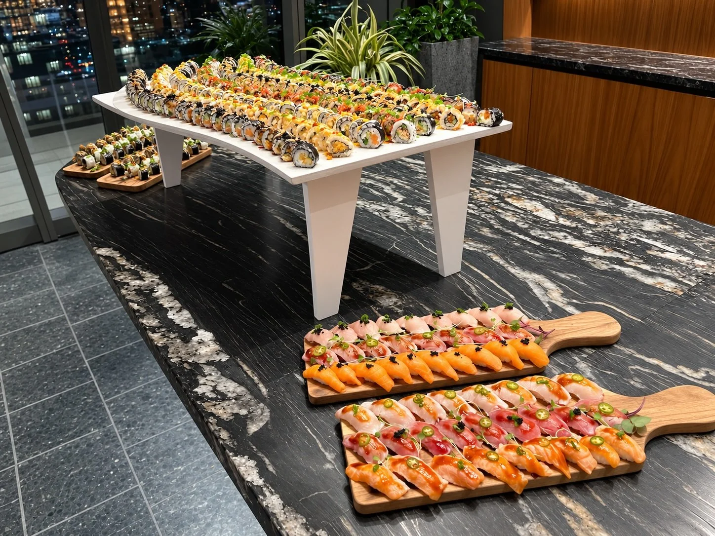 Sushi rolls elegantly displayed on modern stands and wooden boards for a catering event