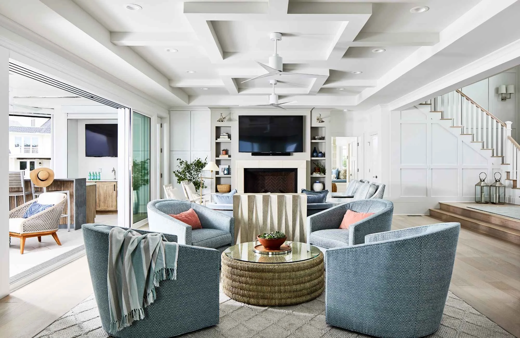 christie-leu-interiors-rockville-md-scale-and-proportion-large-open-concept-living-room-blue-upholstered-chairs-ceiling-detail-beach-house-efficient.jpg