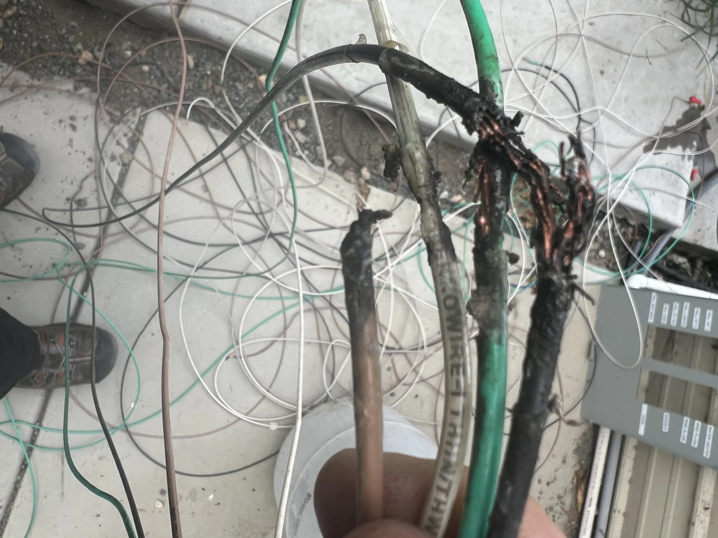 Loose wires create "arcing"—tiny sparks that generate intense heat and are a leading cause of attic fires. Call GreenLine Lighting & Electric to schedule a professional electrical safety audit.