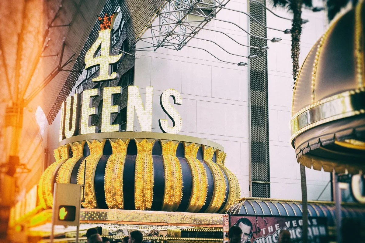 Four Queens Hotel and Casino sign with lights and crown decoration on Fremont Street, Las Vegas.