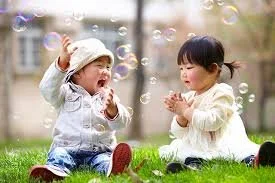 Toddlers blowing bubbles.jpeg