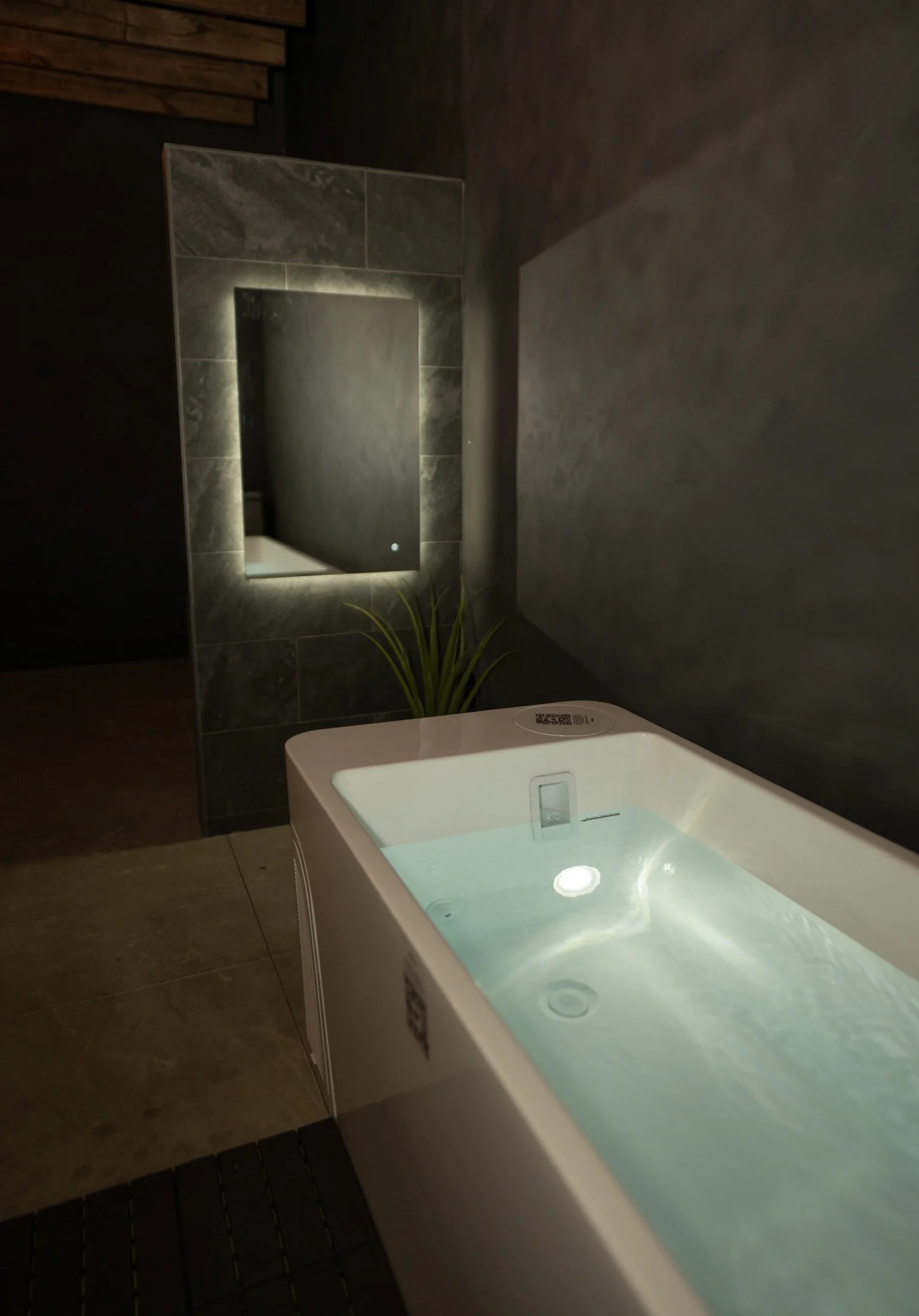 Member in cold plunge bath at The 1 Fitness, Evans Farm – boosting circulation, recovery, and wellness amenities.