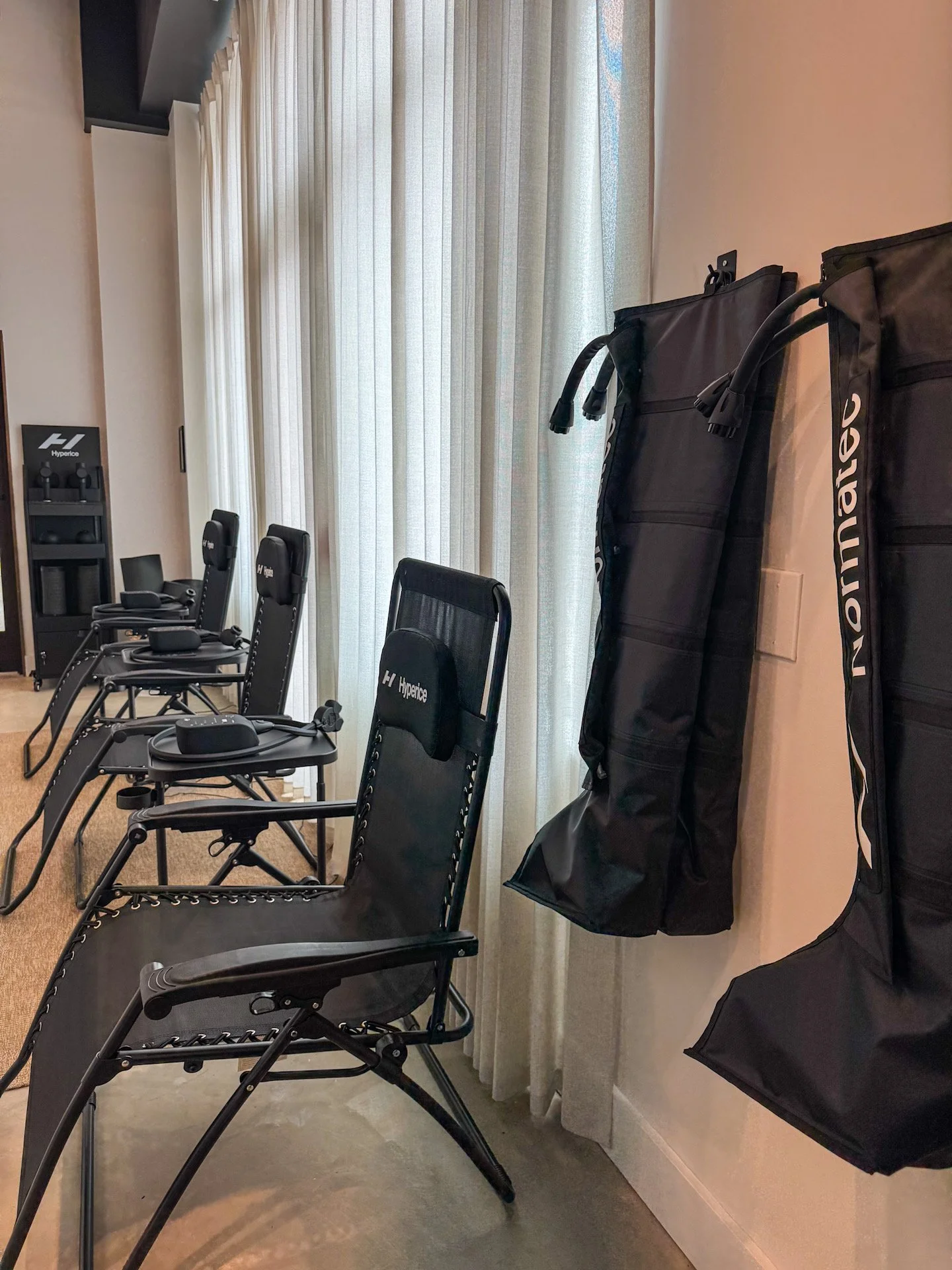 Recovery lounge at The 1 Fitness – Normatec boots, cold plunge and infrared saunas
