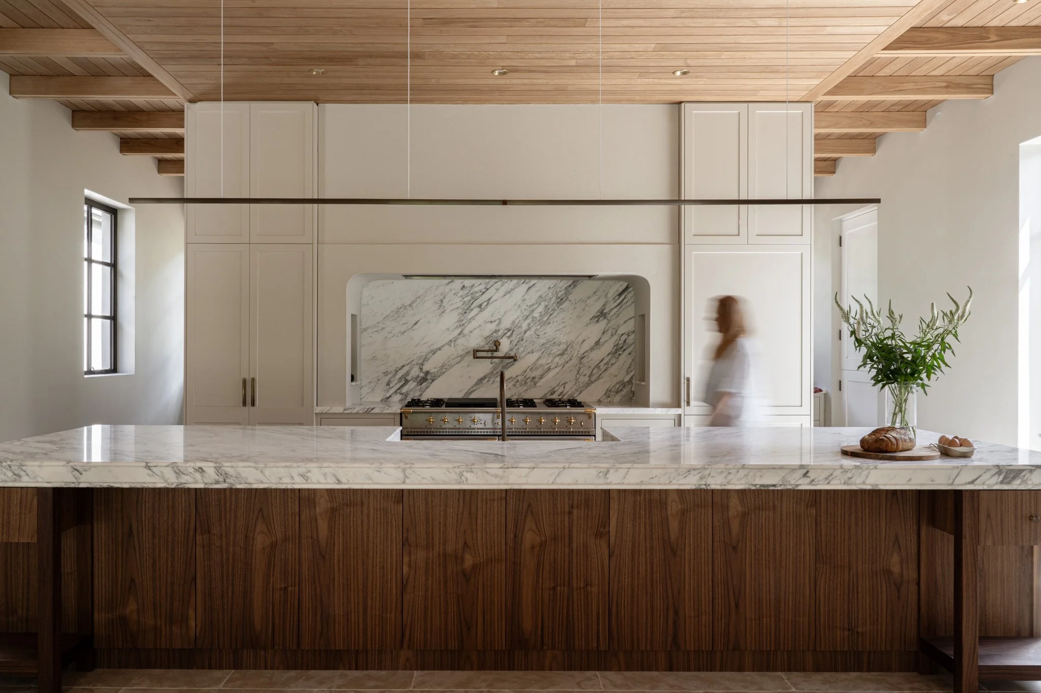 Hallway with timber floors, wall sconces and soft natural light in a Southern Highlands home