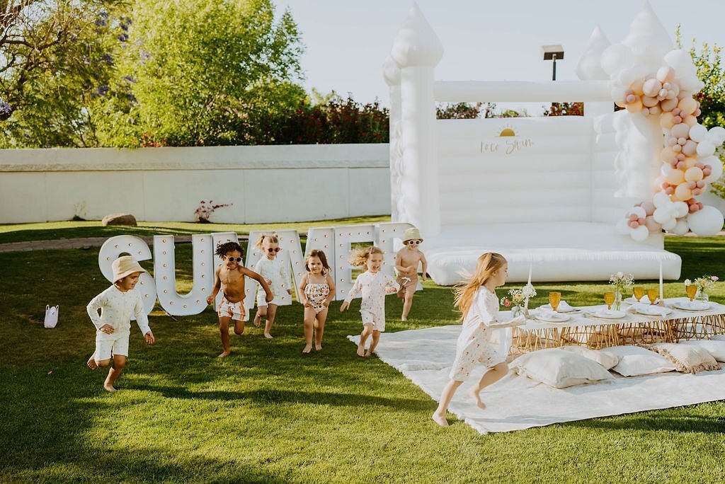 READY, SET, GO!! Throw a bounce castle in the backyard for your Father&rsquo;s Day bbq this weekend and keep those kiddos happy 😁
.
.
Swimsuits - @rocoswim 
Bounce House - @inflatefortyeight
Marquee Letters - @alphalitphoenix 
Signage - @desertdraws