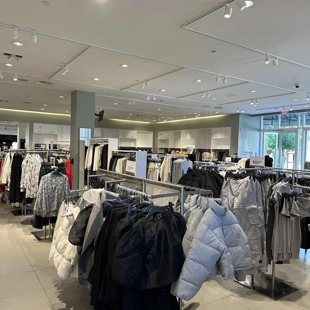 Finished interior retail lighting installation at H&amp;M tenant improvement in Arden Fair Mall