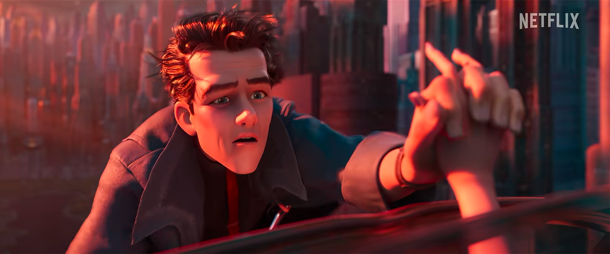 Animated scene of a young man with brown hair reaching out with his hand, looking distressed, in front of a blurred background of bookshelves, with the Netflix logo in the top right corner.