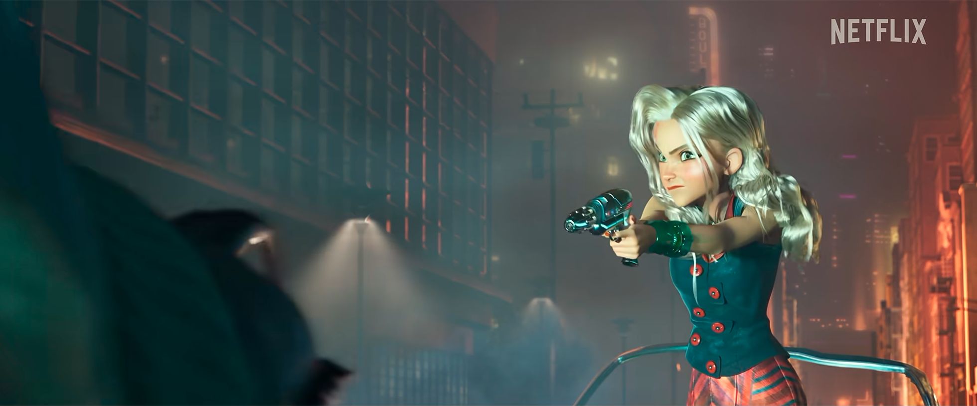 Animated woman with blonde hair pointing a gun at a person with a blurred face in a city at night with neon lights and buildings in the background, with Netflix logo in the top right corner.