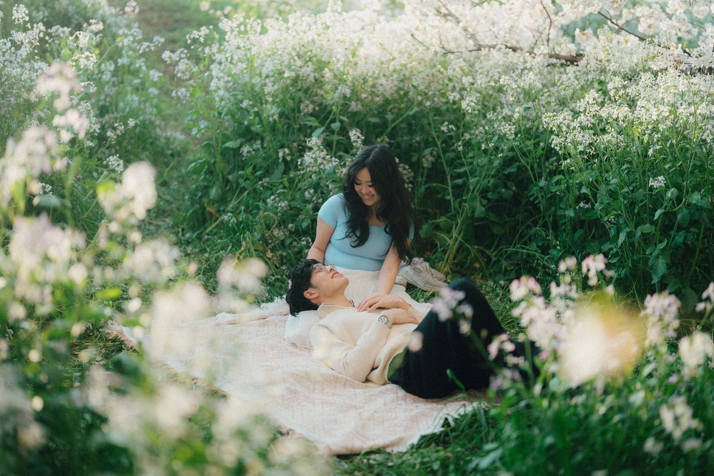 Couple picnic surrounded by flowers.jpg