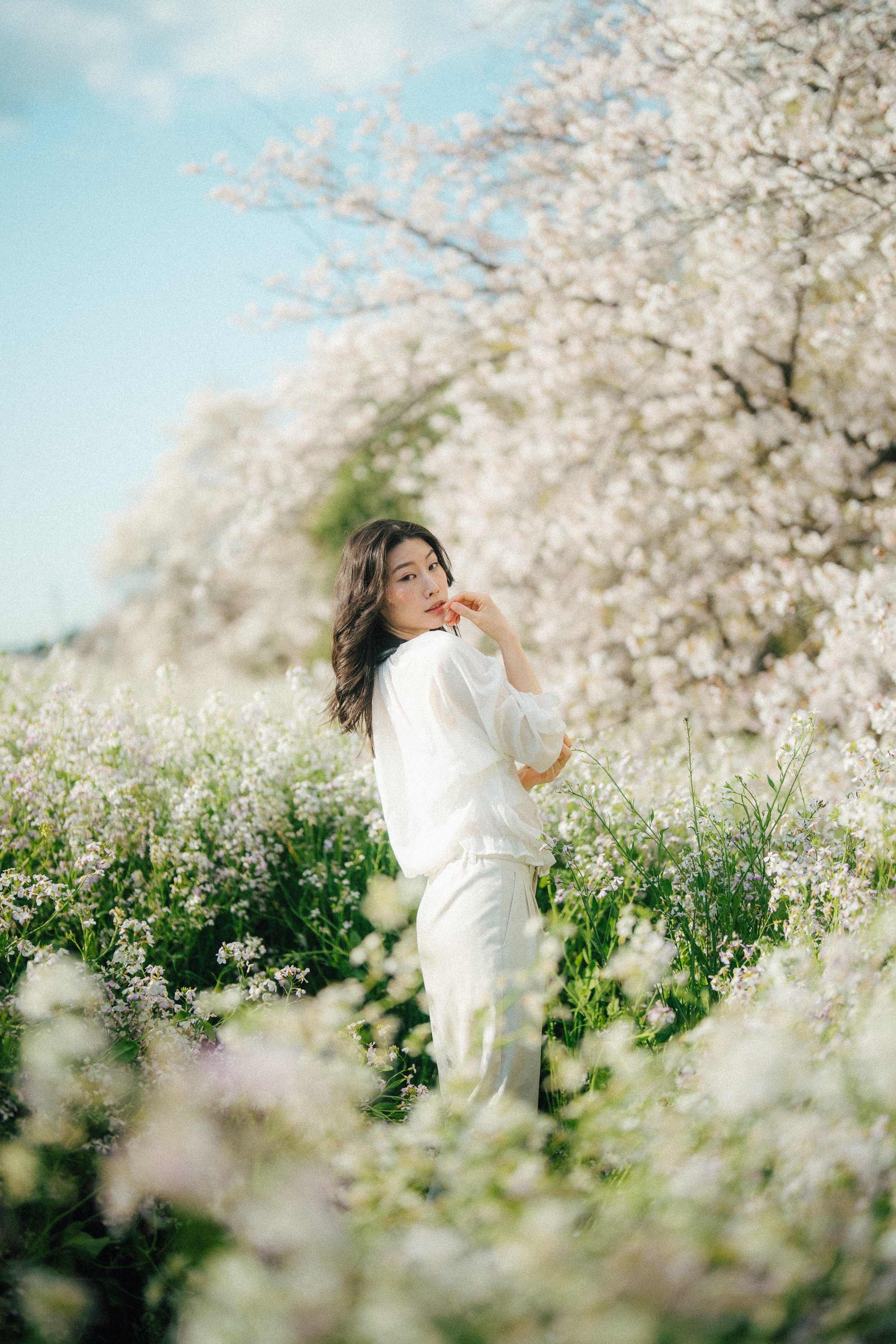 Girl surrounded by flowers.jpg