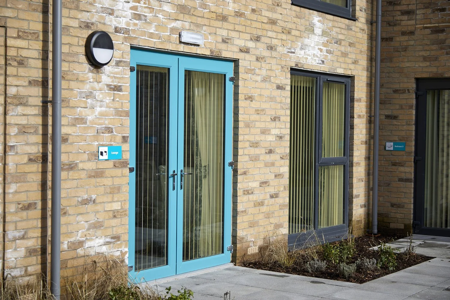 2026-02-Springfield-Vale-exterior-low-res-teal-door (2).jpg