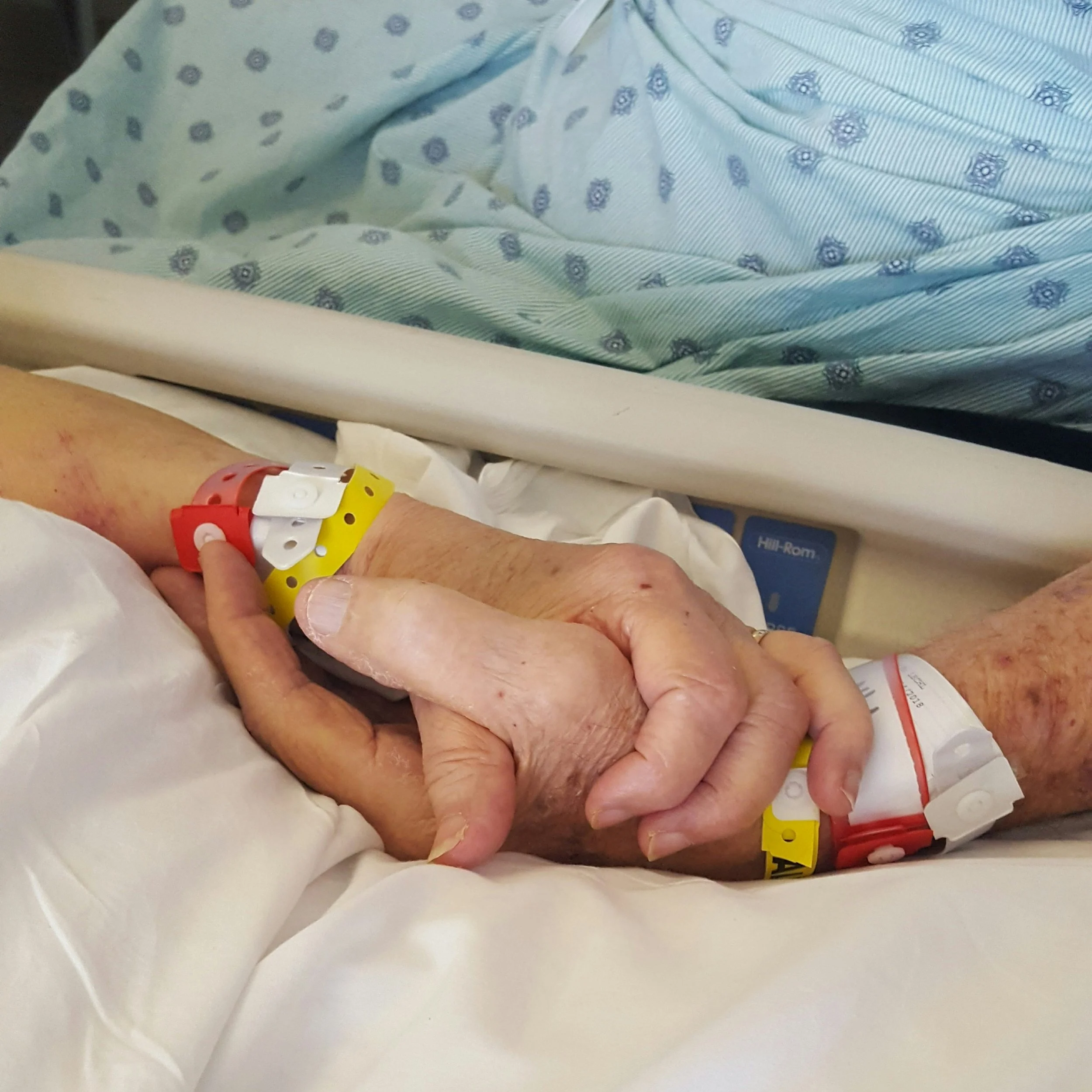 Patient hands in hospital symbolising delayed cancer diagnosis and treatment