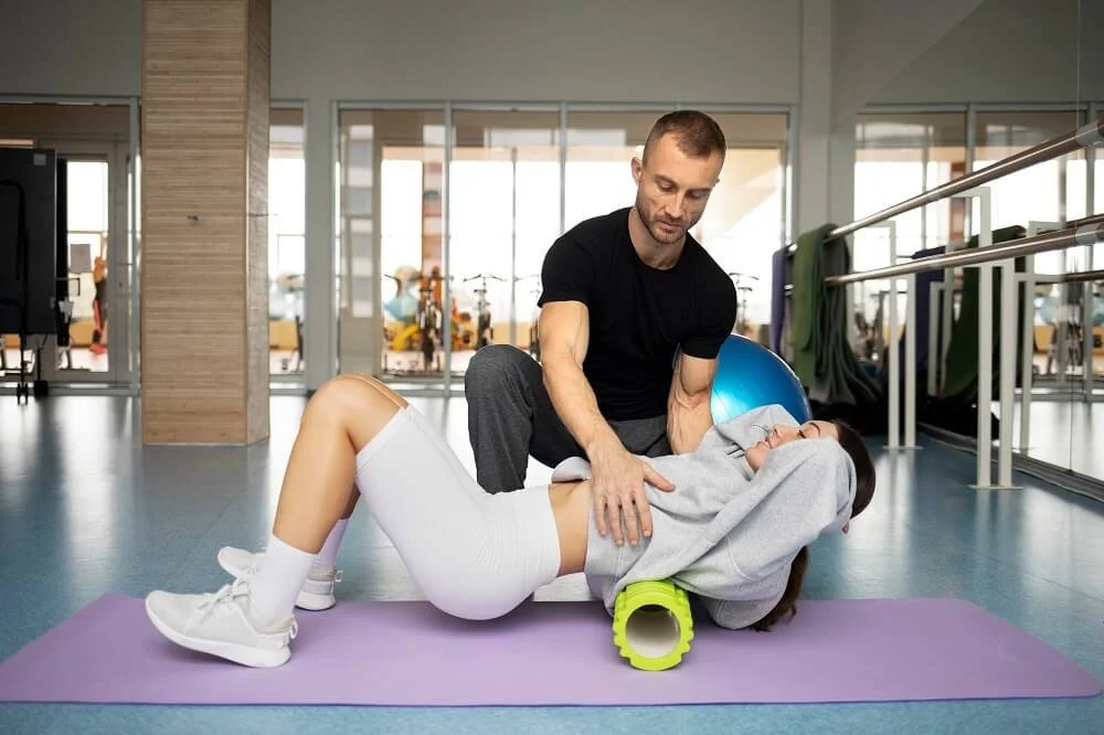 patient-doing-physical-rehabilitation-helped-by-therapists