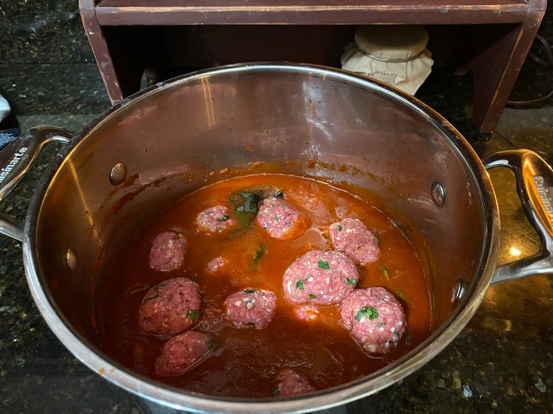 Add meatballs to sauce. Cover and simmer on low for three hours.