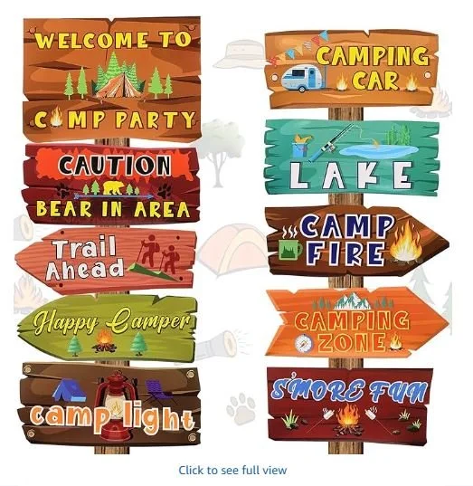 A stock image of cartoon wooden signs made for a camping-themed party. The signs are various colors and say various things, from "Welcome to Camp Party" to "S'More Fun."