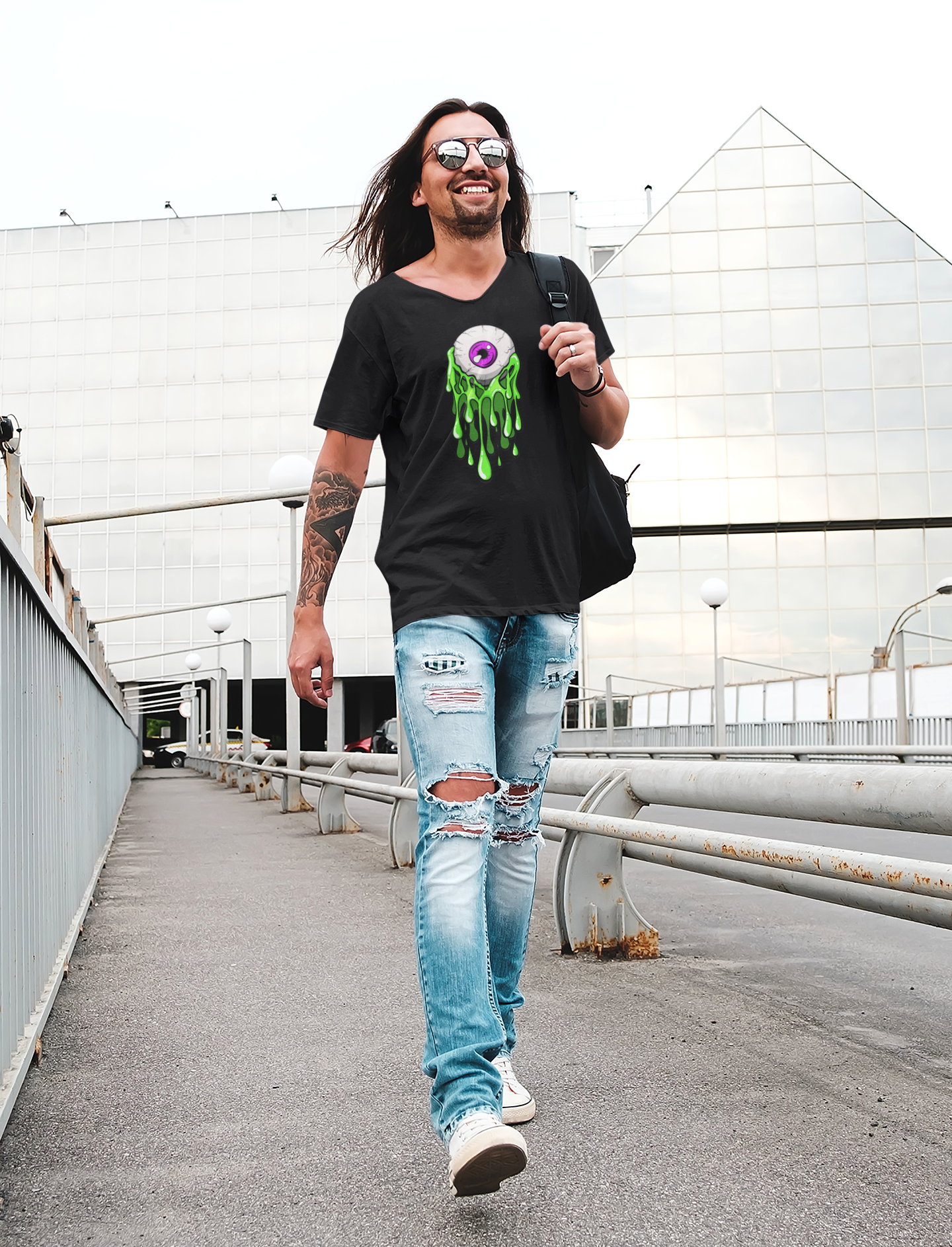 t-shirt-mockup-of-a-tattooed-long-haired-man-with-ripped-jeans-38244r-el2.png
