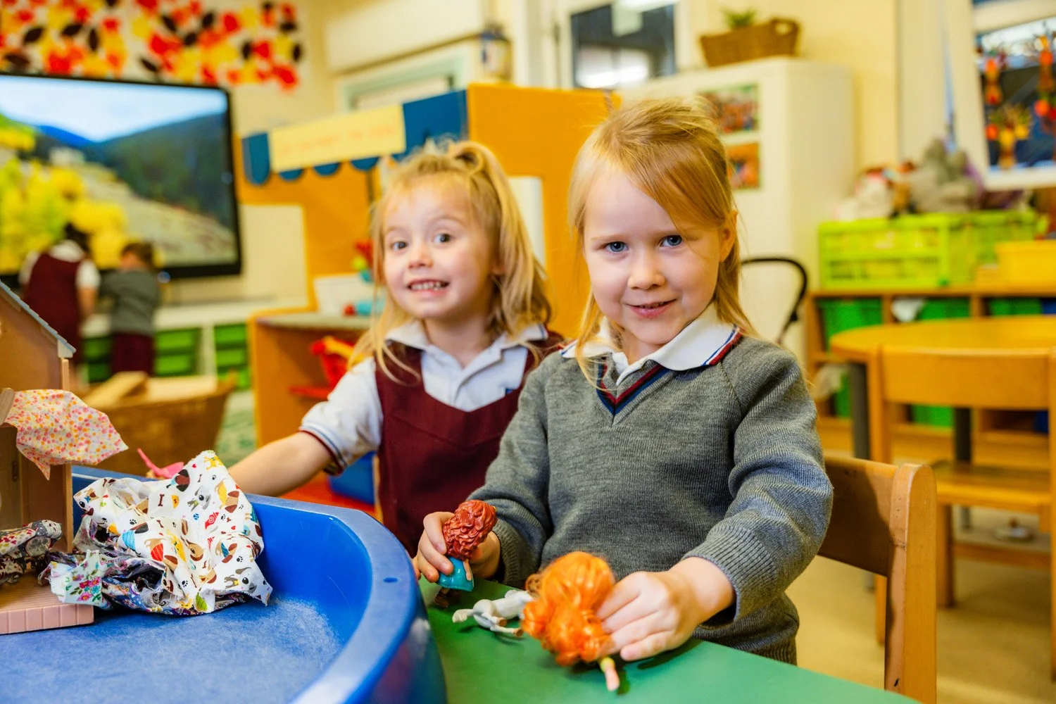 DSC03329-two-girls-playing-with-toy-figures-and-dolls-house.jpg