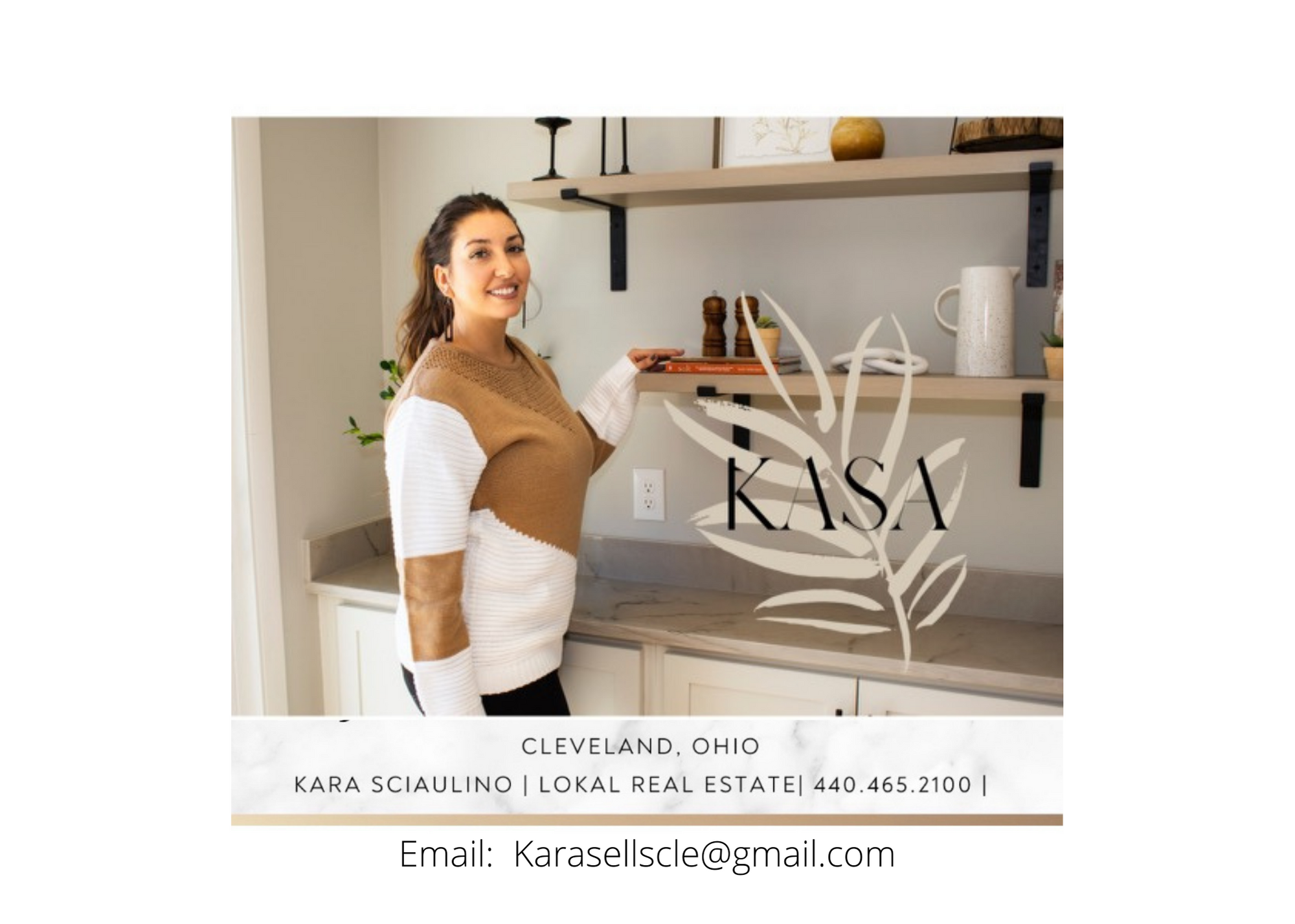 A real estate agent standing in a kitchen with beige and white decor, smiling, wearing a color block sweater. The image includes contact information for Kara Scaullino, a local real estate agent in Cleveland, Ohio, with her email address and phone number.