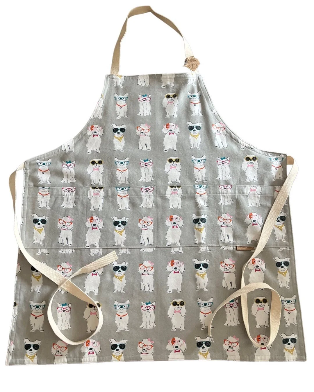 Calling all dog lovers! 🐾🎀 Introducing our brand new dog print apron, designed especially for those who can't get enough of their furry friends. 🐶💕 This apron features a delightful print of various dog breeds, making it the perfect accessory for 