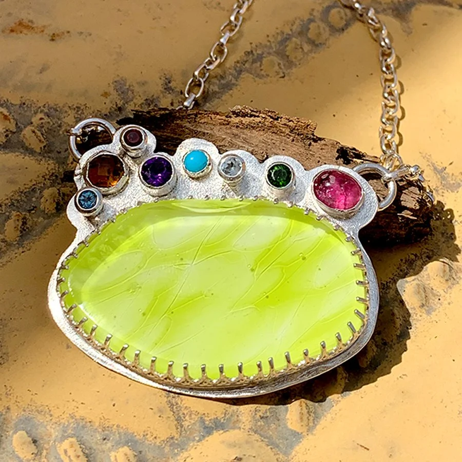 necklace -
wgw lemon glass, chrome diopside, amethyst, madeira citrine, sleeping beauty turquoise, pink tourmaline, blue topaz, garnet, set in sterling silver